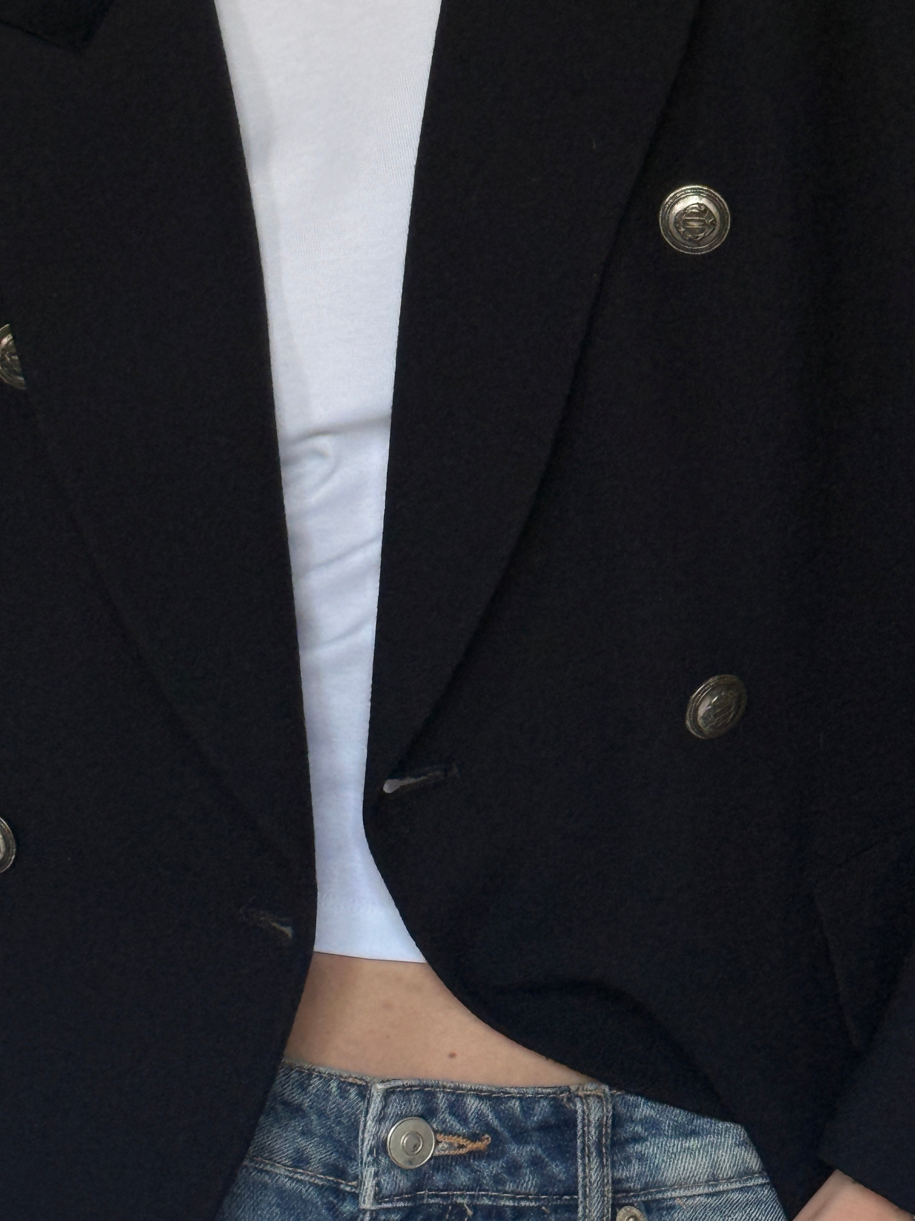 Vintage black wool blazer fabric close-up