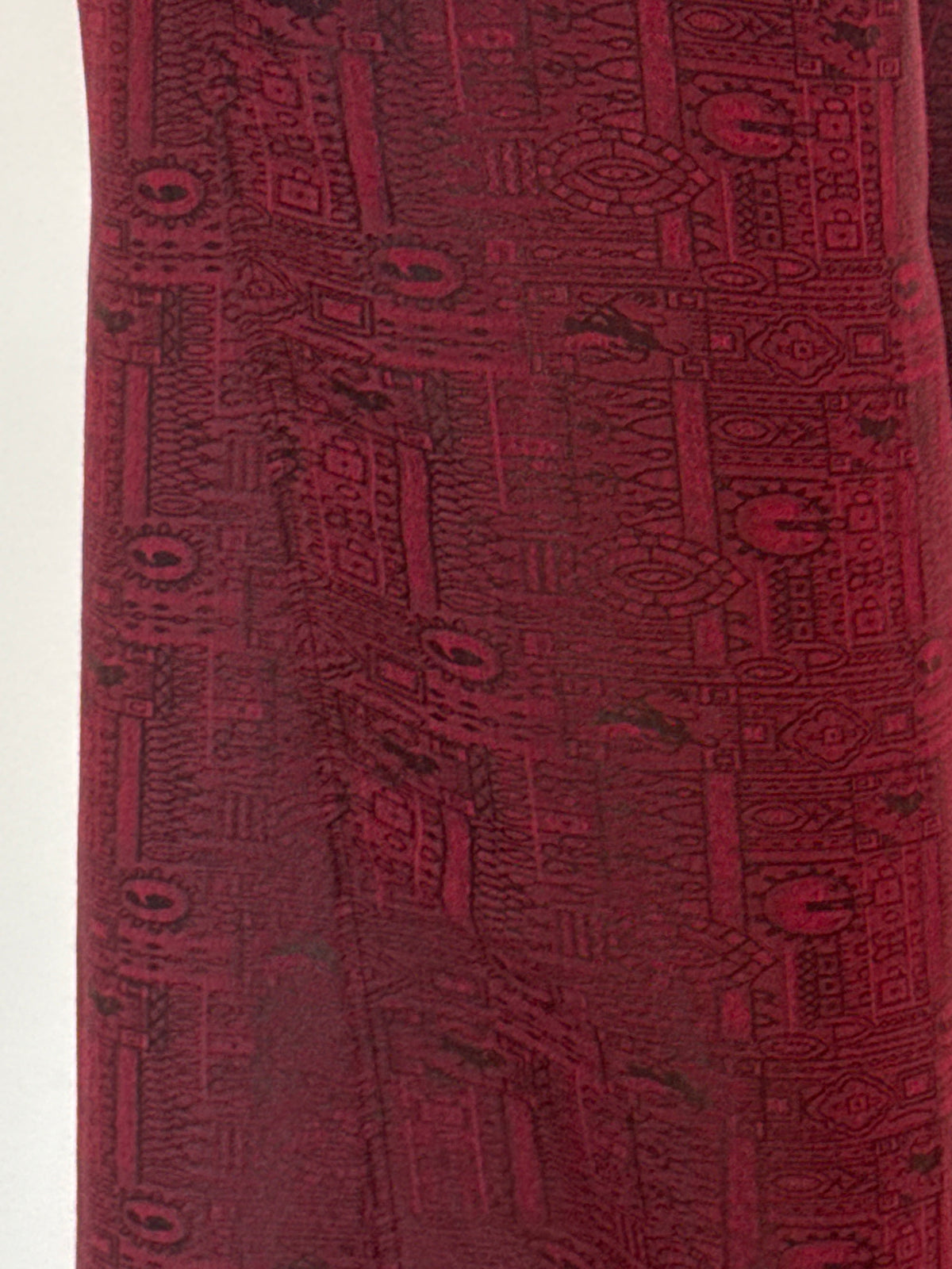 Vintage burgundy pants fabric close-up