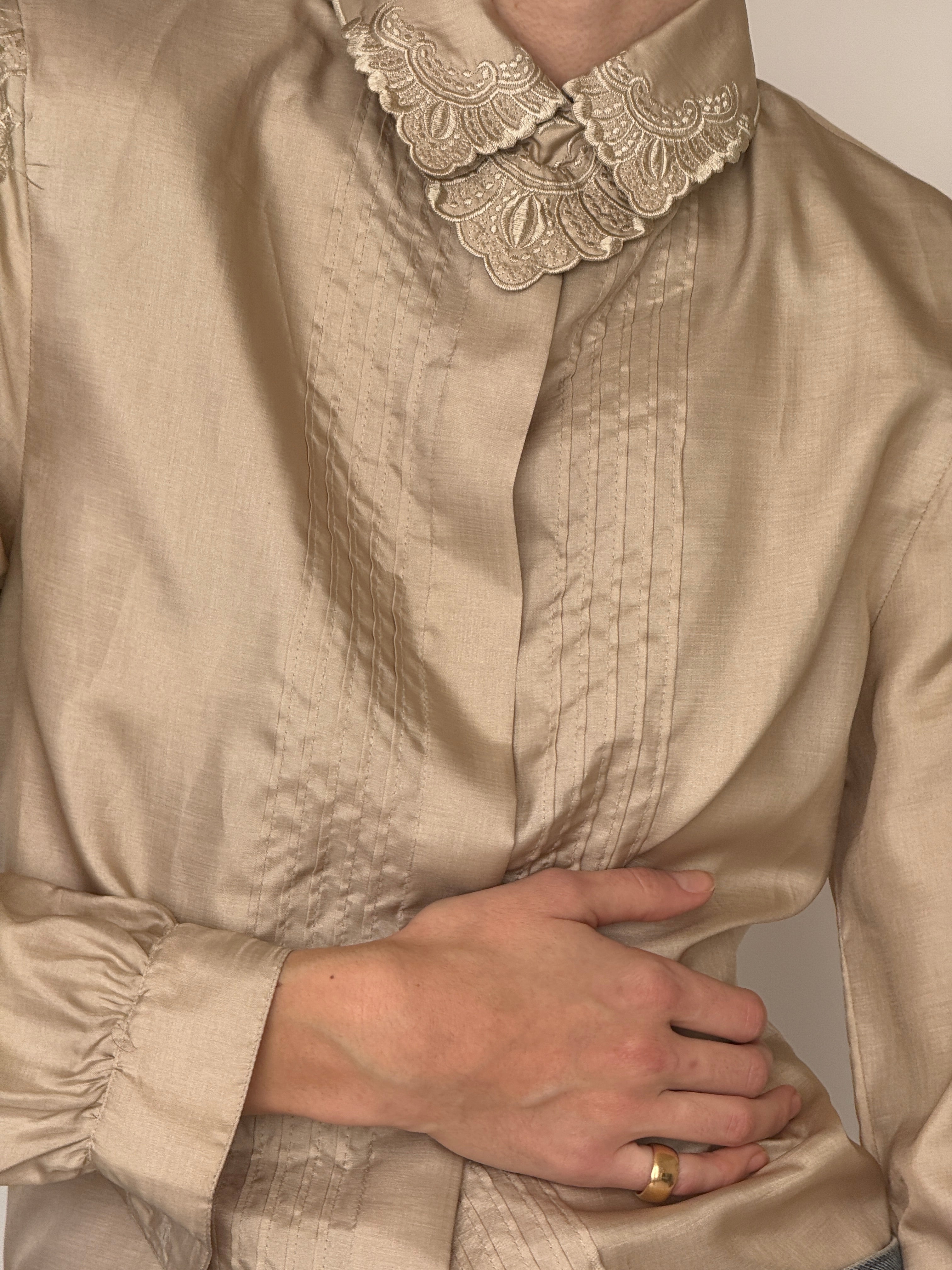 Vintage champagne embroidered collar blouse fabric close-up subtle sheen texture