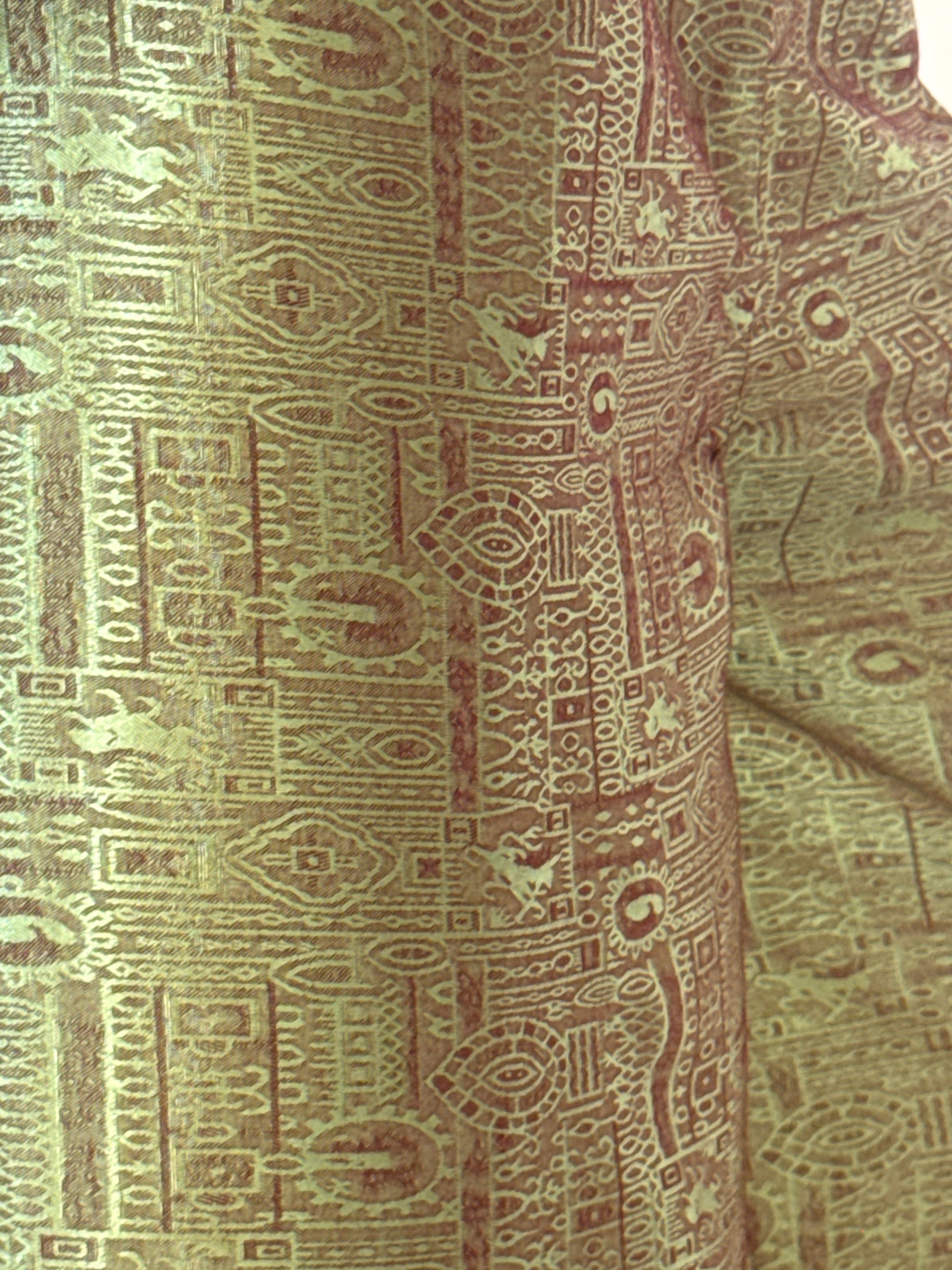 Vintage green patterned fabric close-up