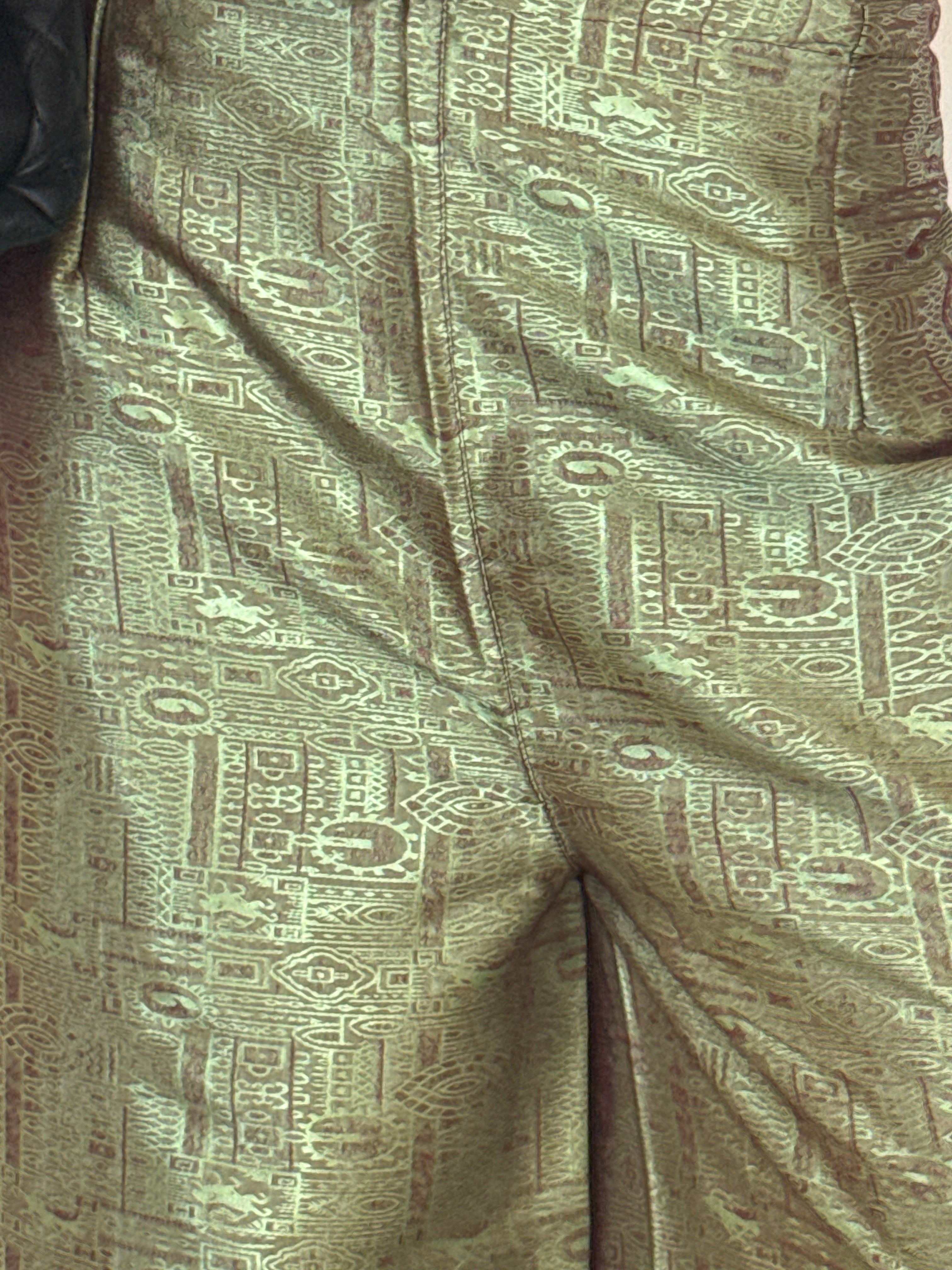 Vintage green patterned fabric close-up