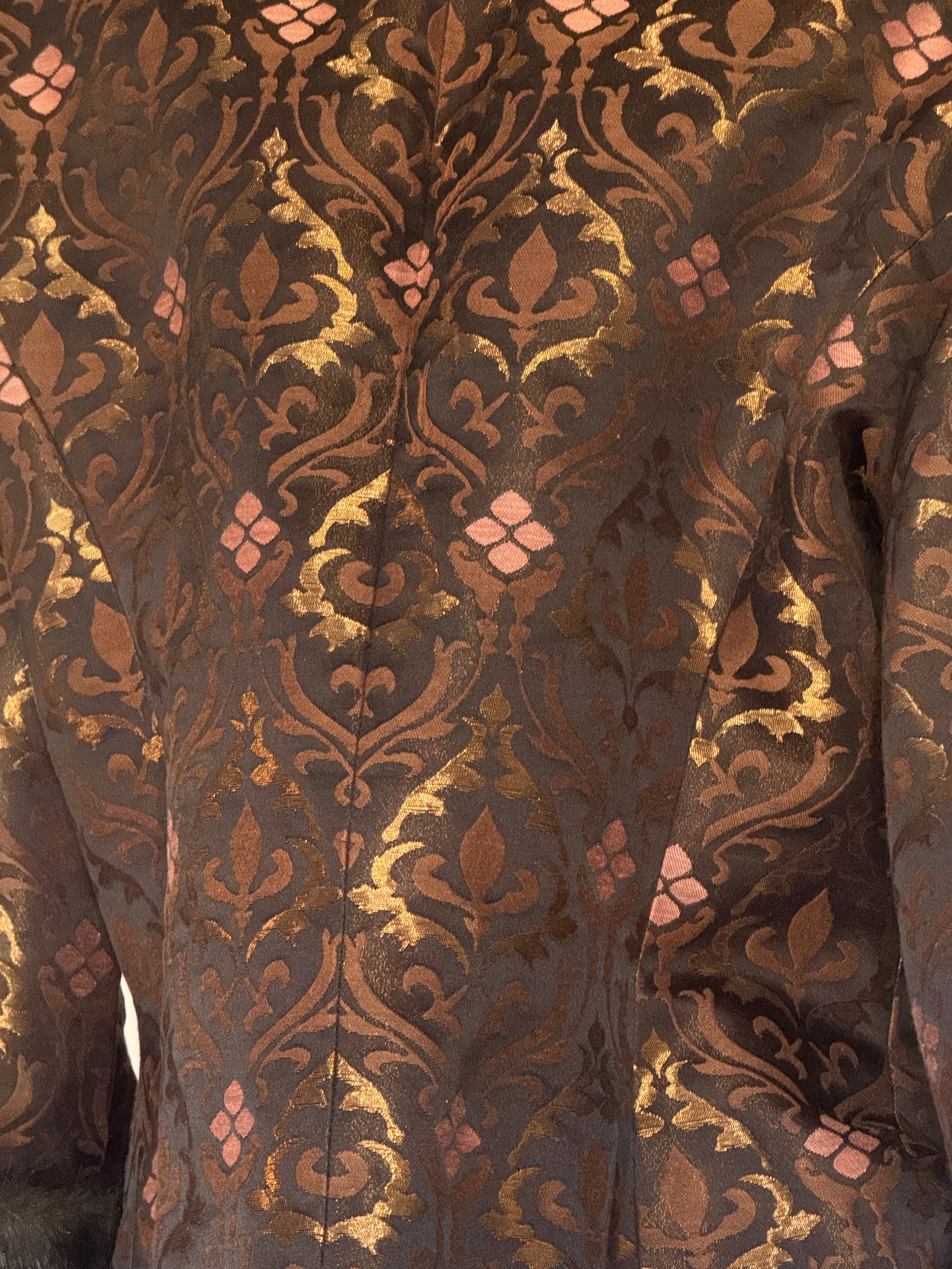 Vintage brown brocade jacket fabric close-up
