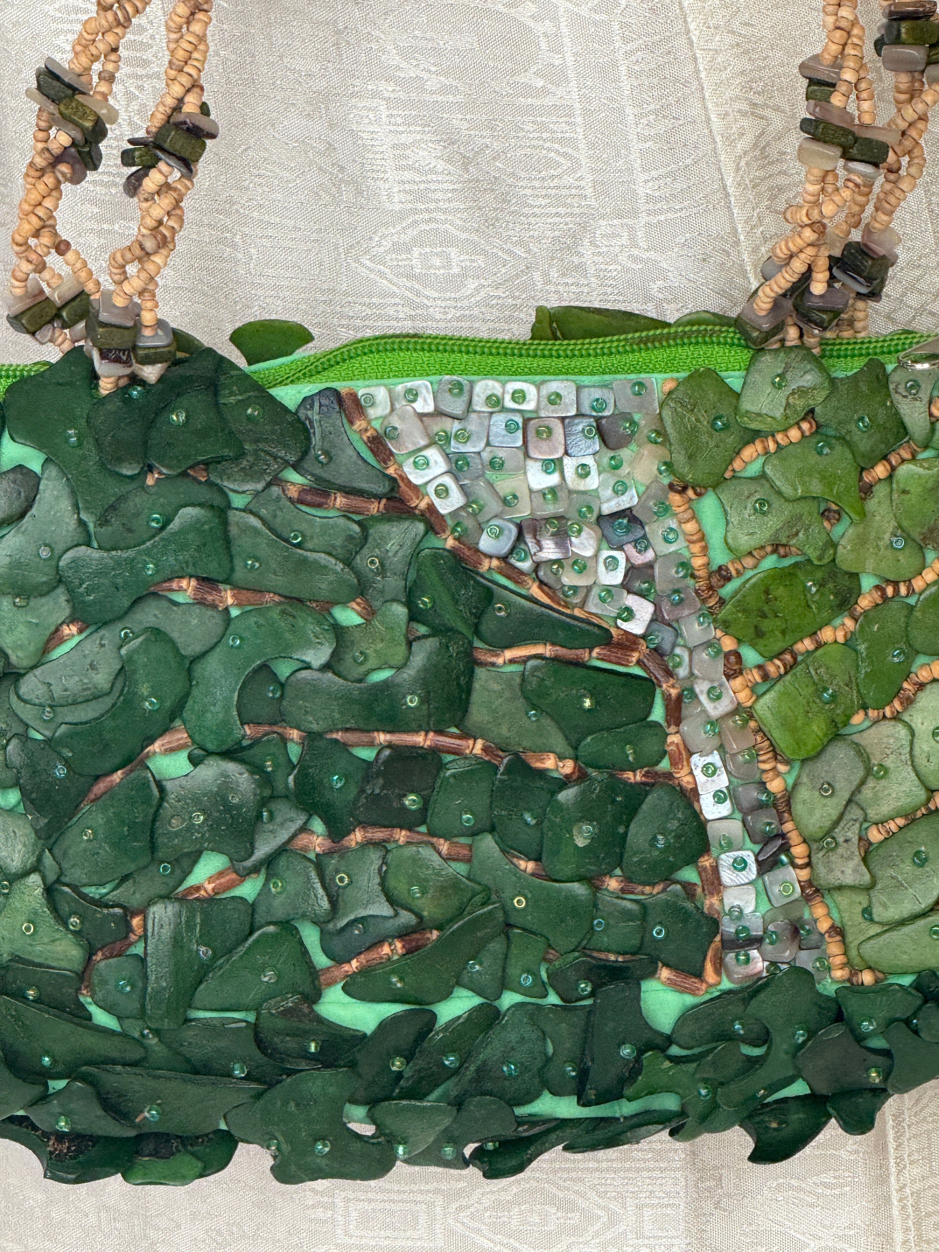 Vintage green handbag textured embellishment close-up