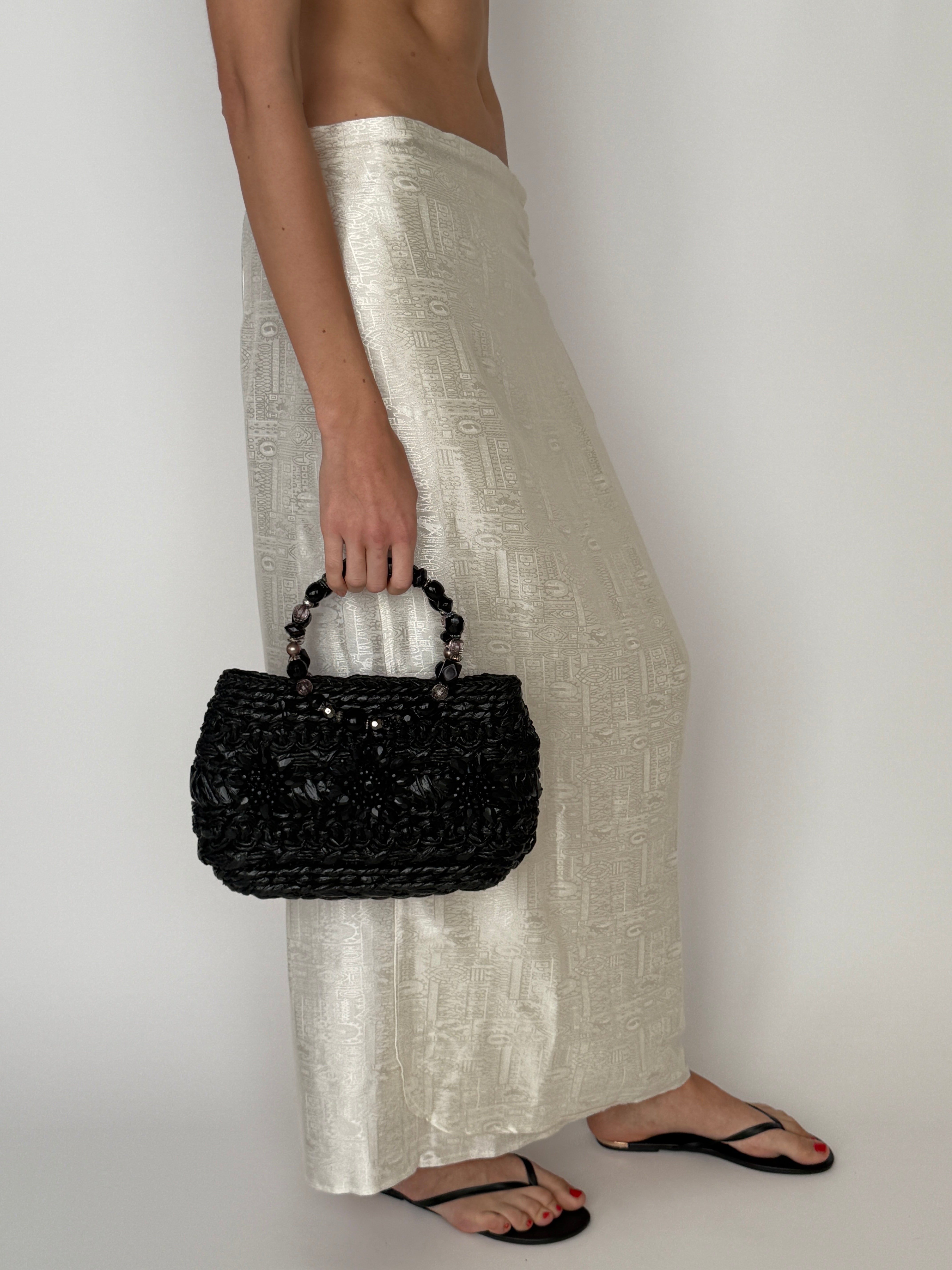 Vintage black woven beaded handle handbag front view