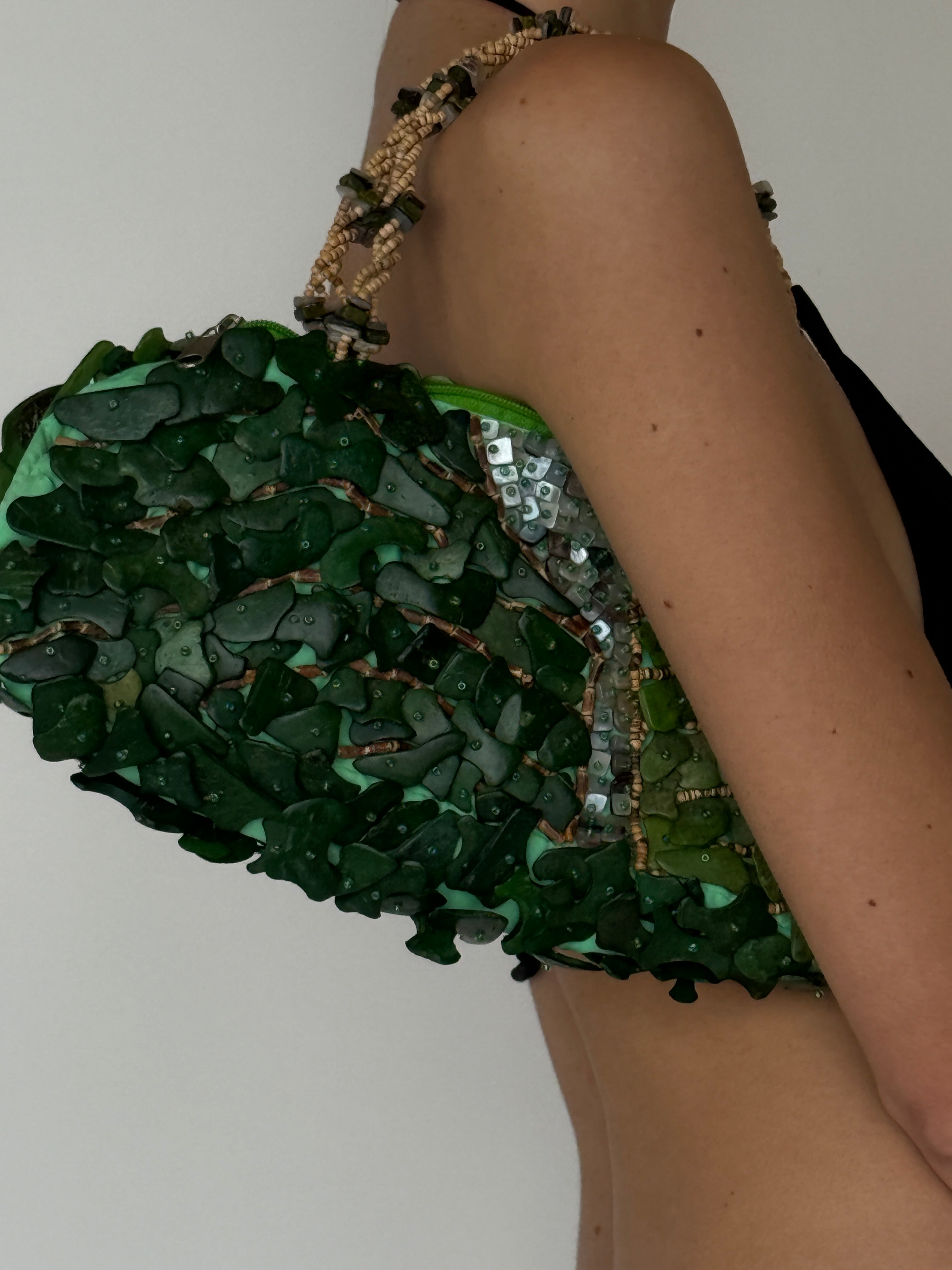 Vintage green beaded handbag carried on model