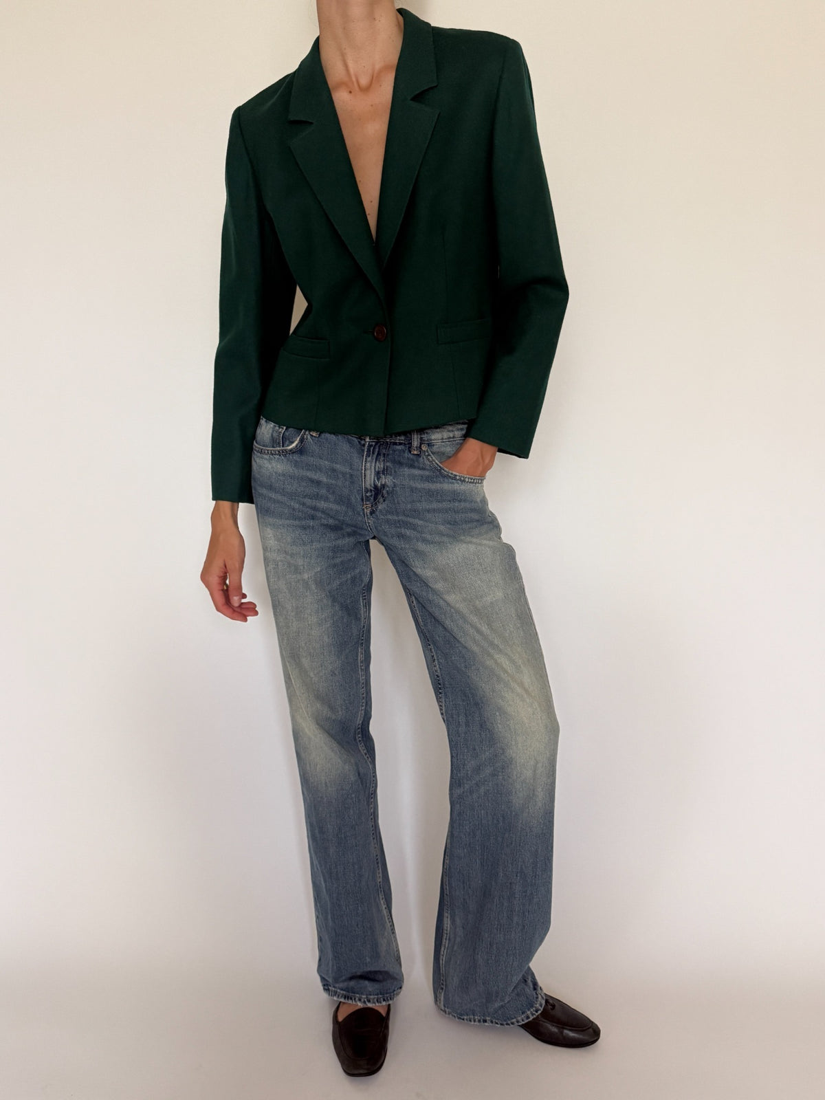 Front view of cropped forest green wool blazer