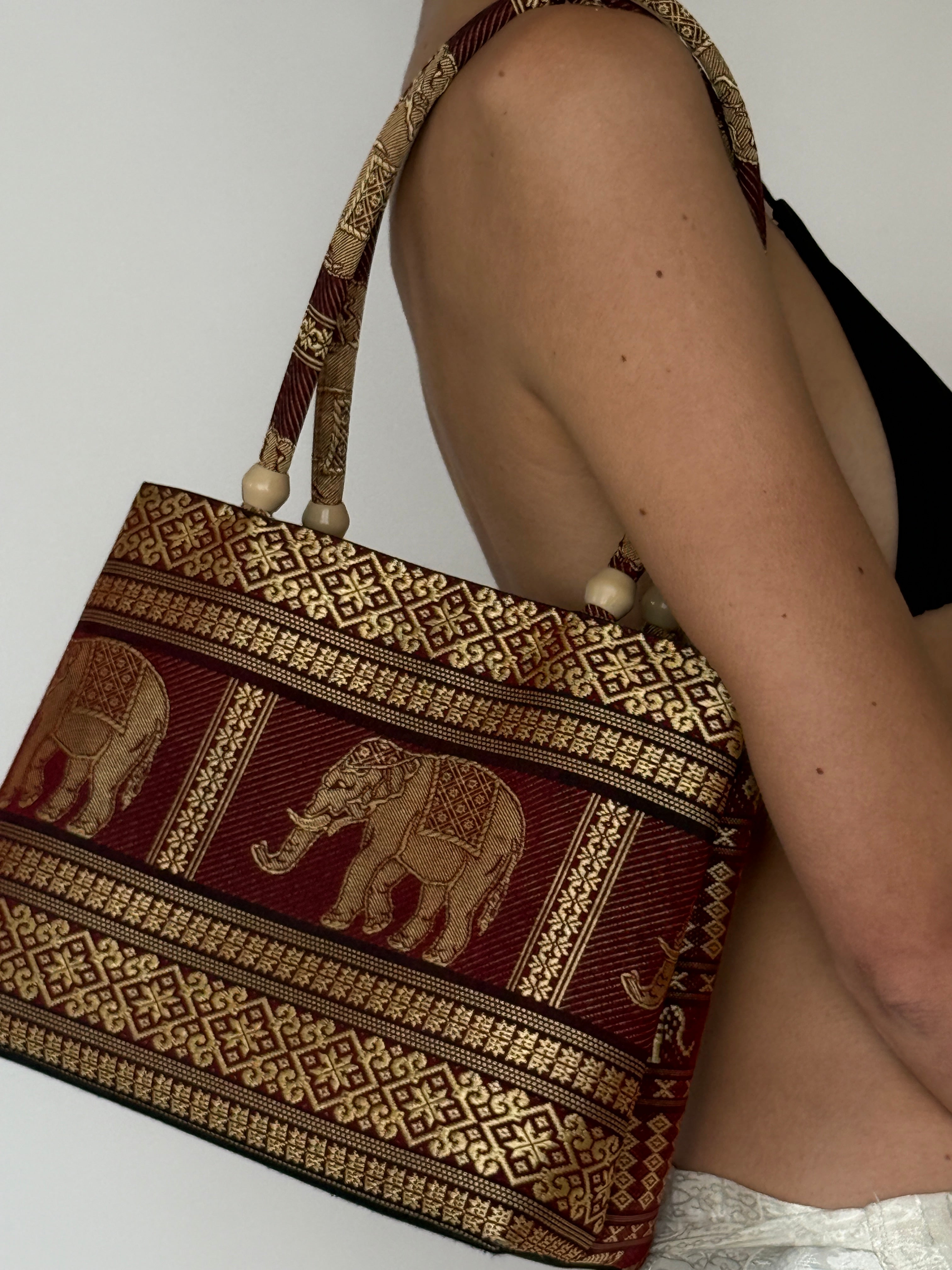 Vintage elephant tapestry shoulder bag front view burgundy and gold