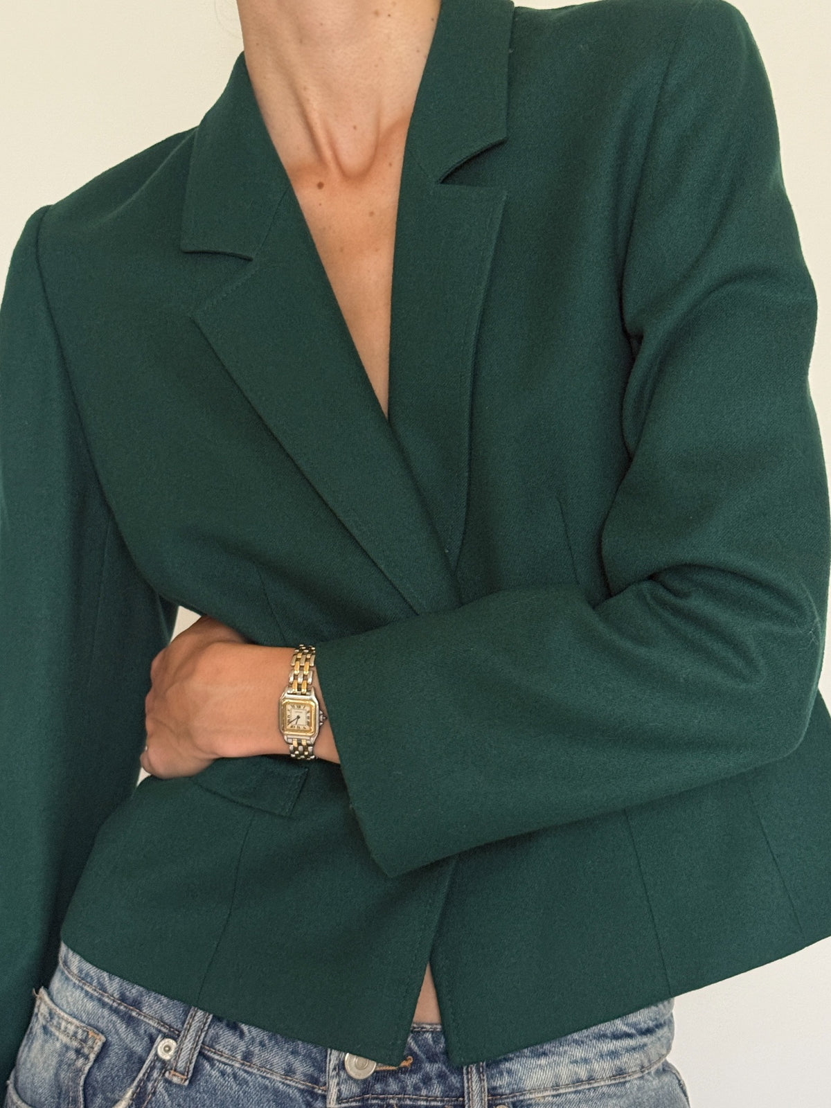 Close-up of forest green wool and notched lapels