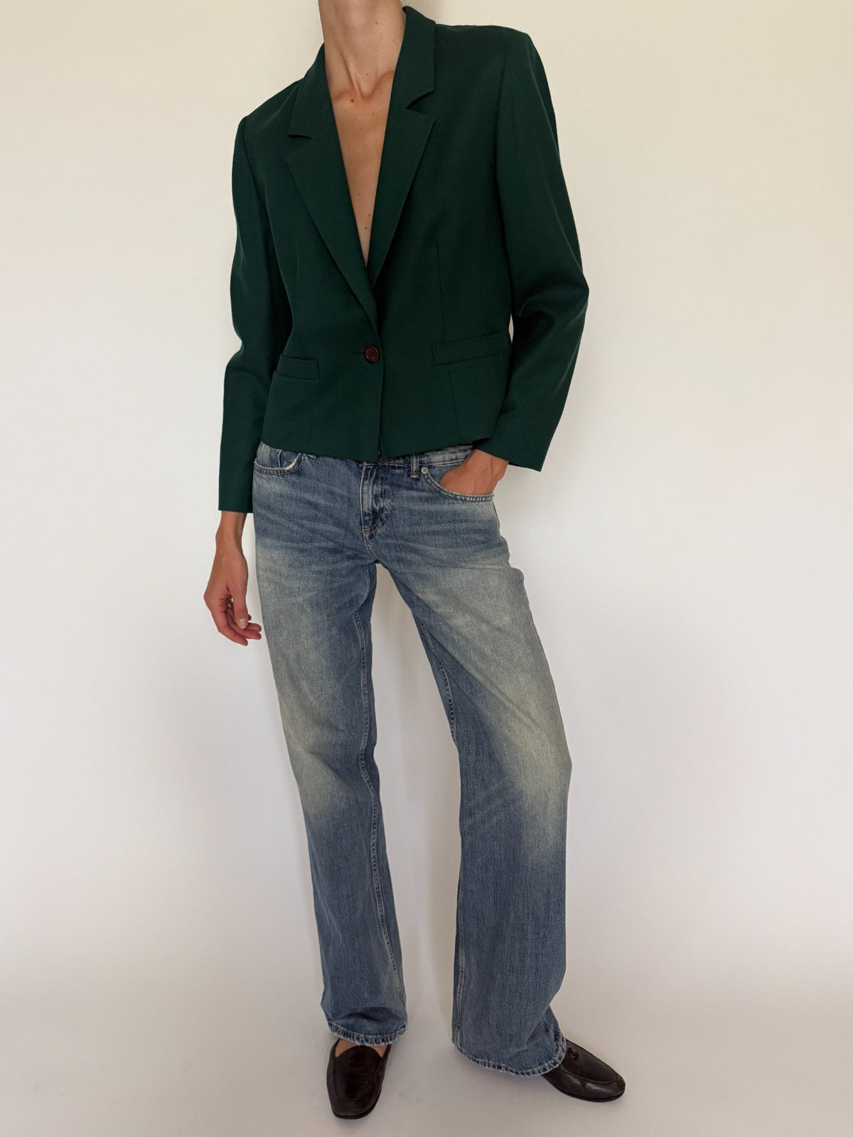 Styled full front view of green blazer with jeans