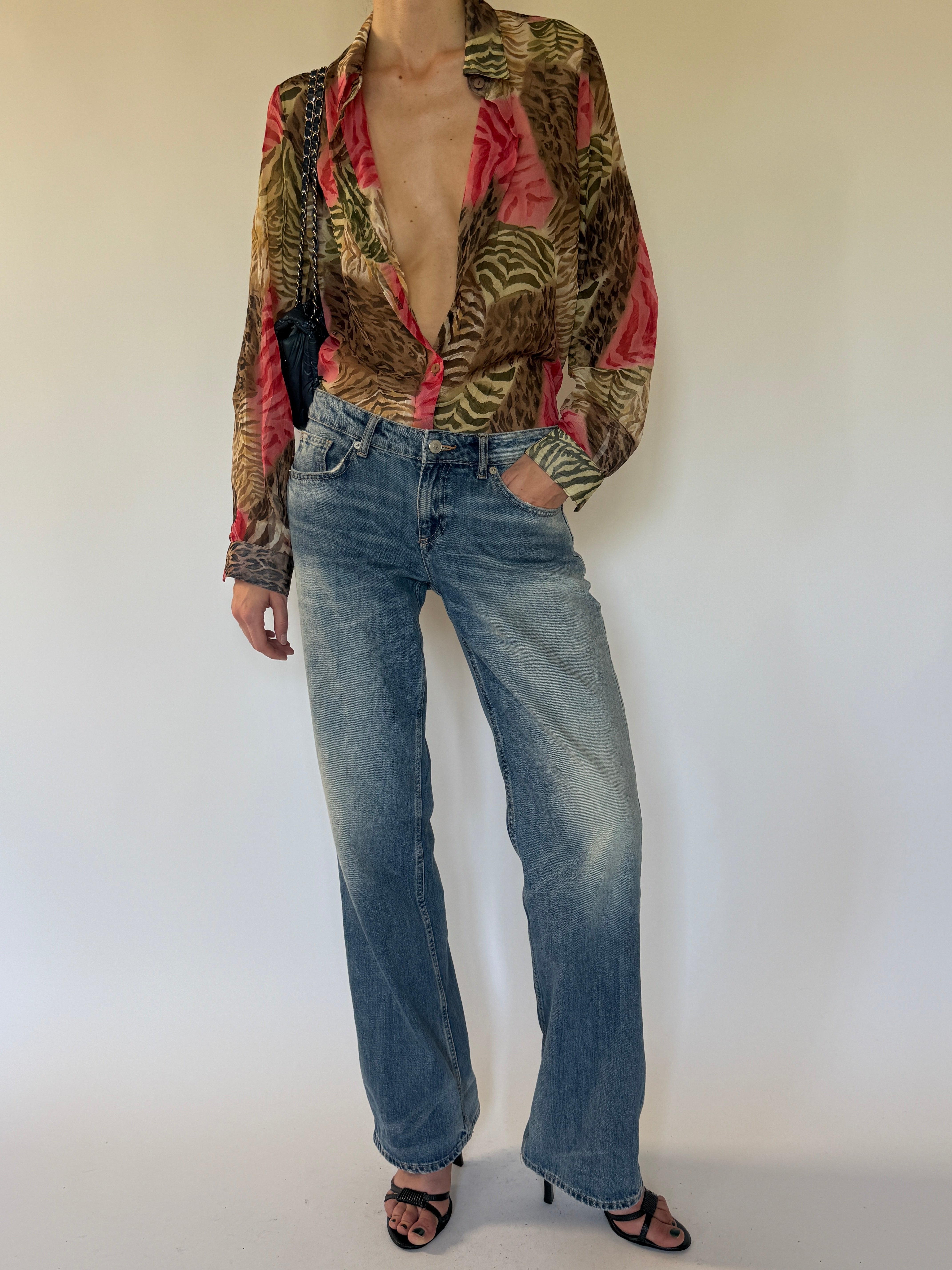 Vintage animal print shirt angled view in pink and earthy tones