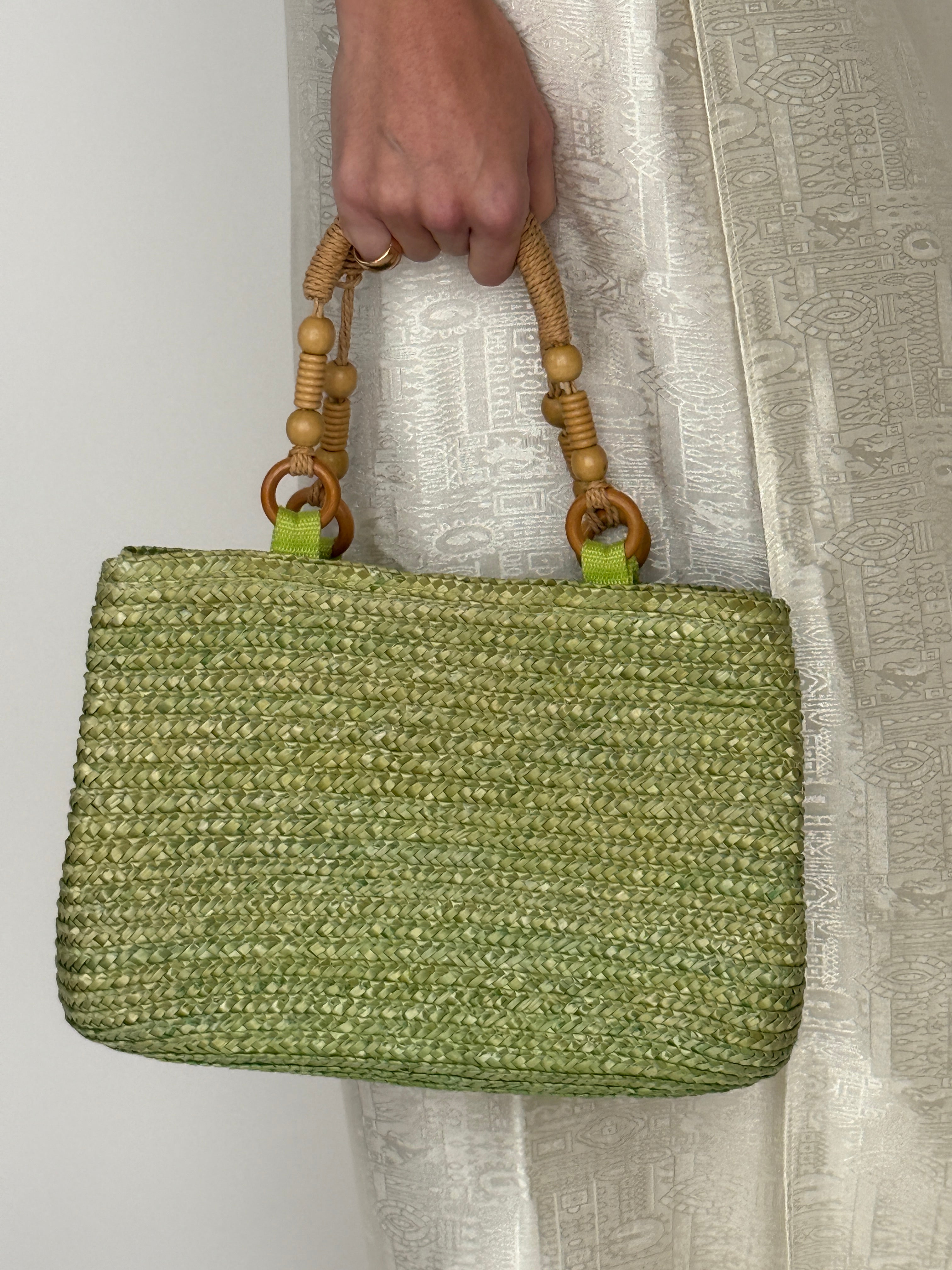 Vintage green woven straw handbag front view