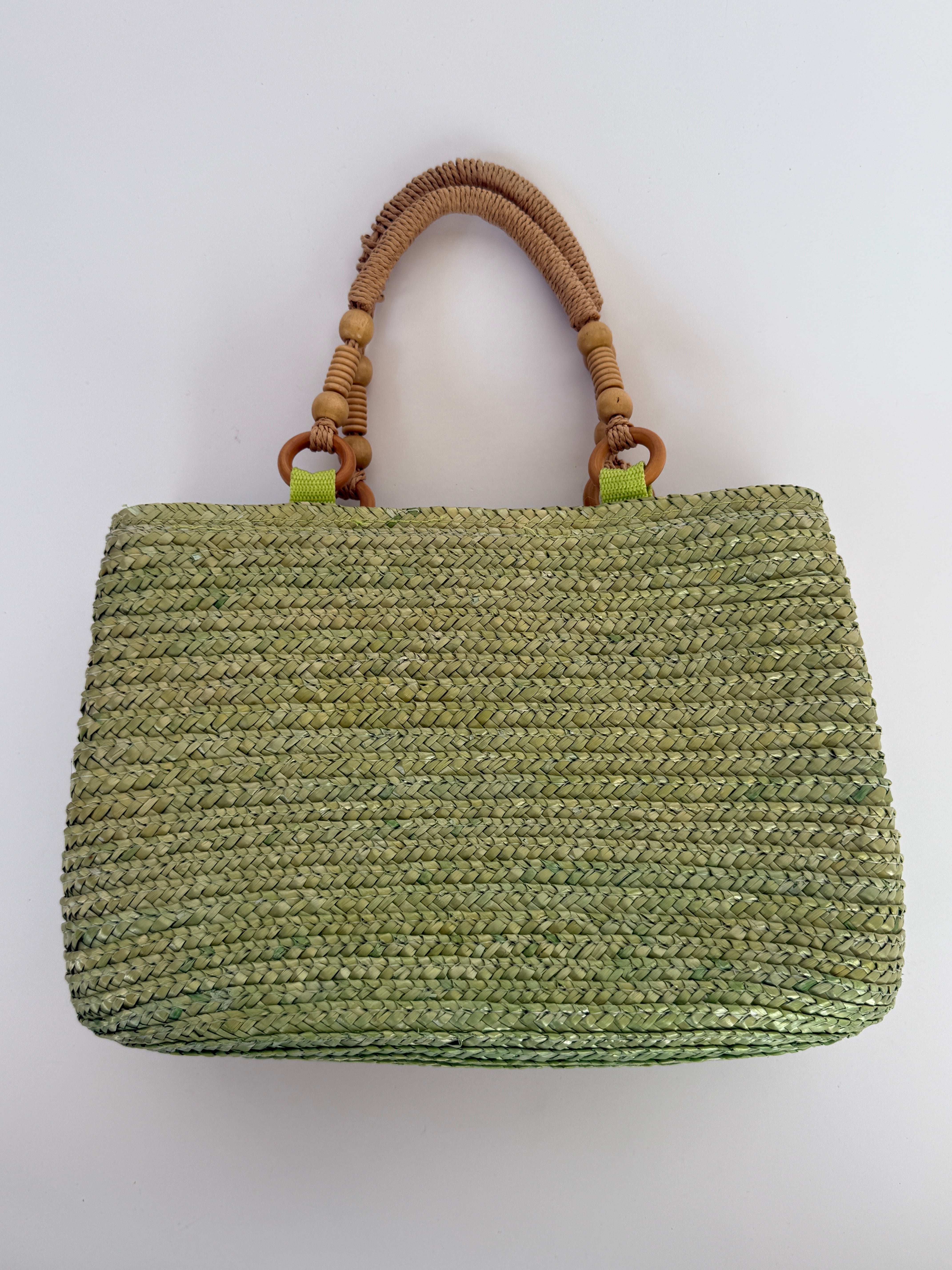 Vintage green woven straw handbag front view