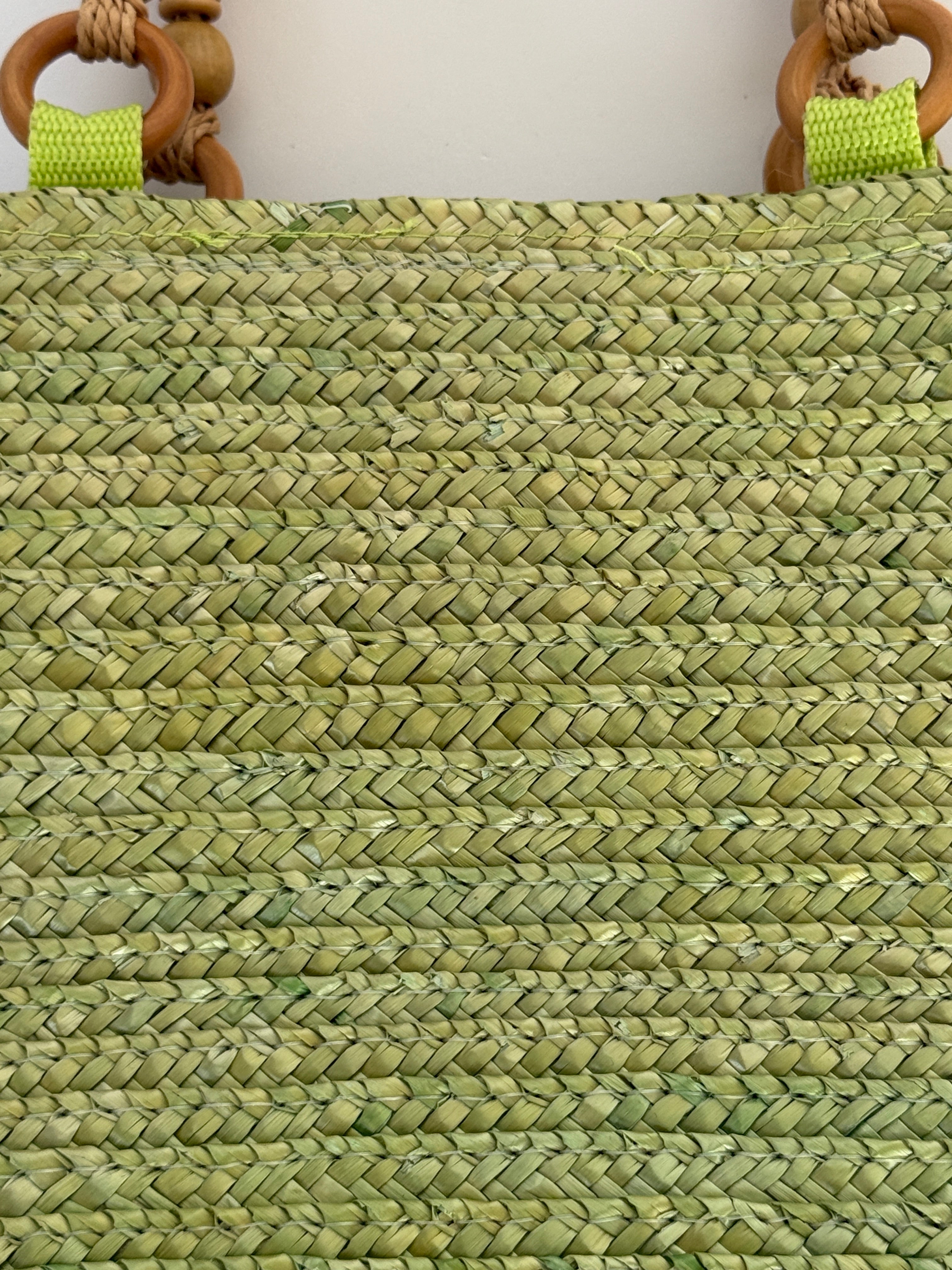Vintage green woven straw handbag woven texture close-up