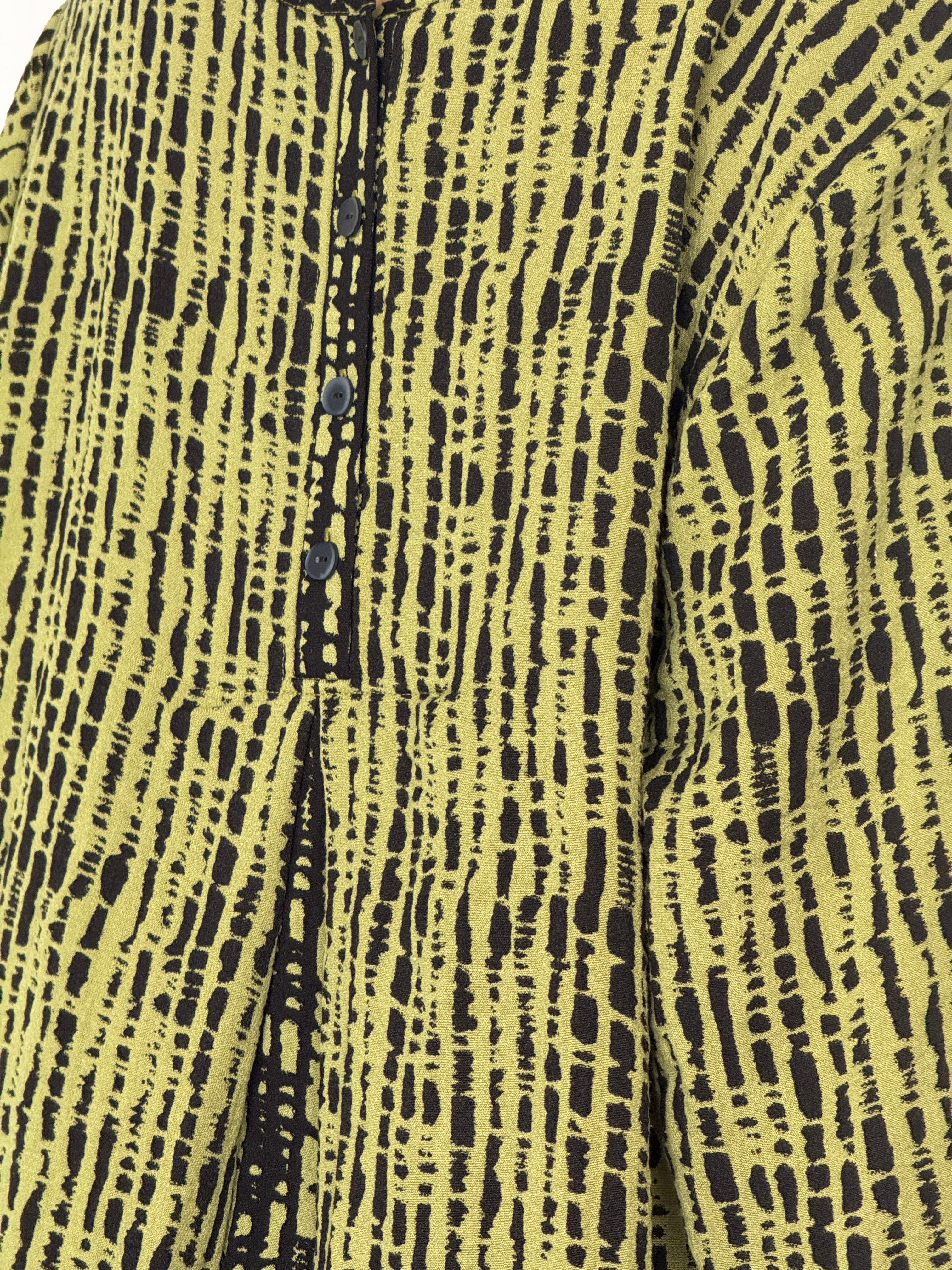 Vintage green dress abstract print fabric close-up