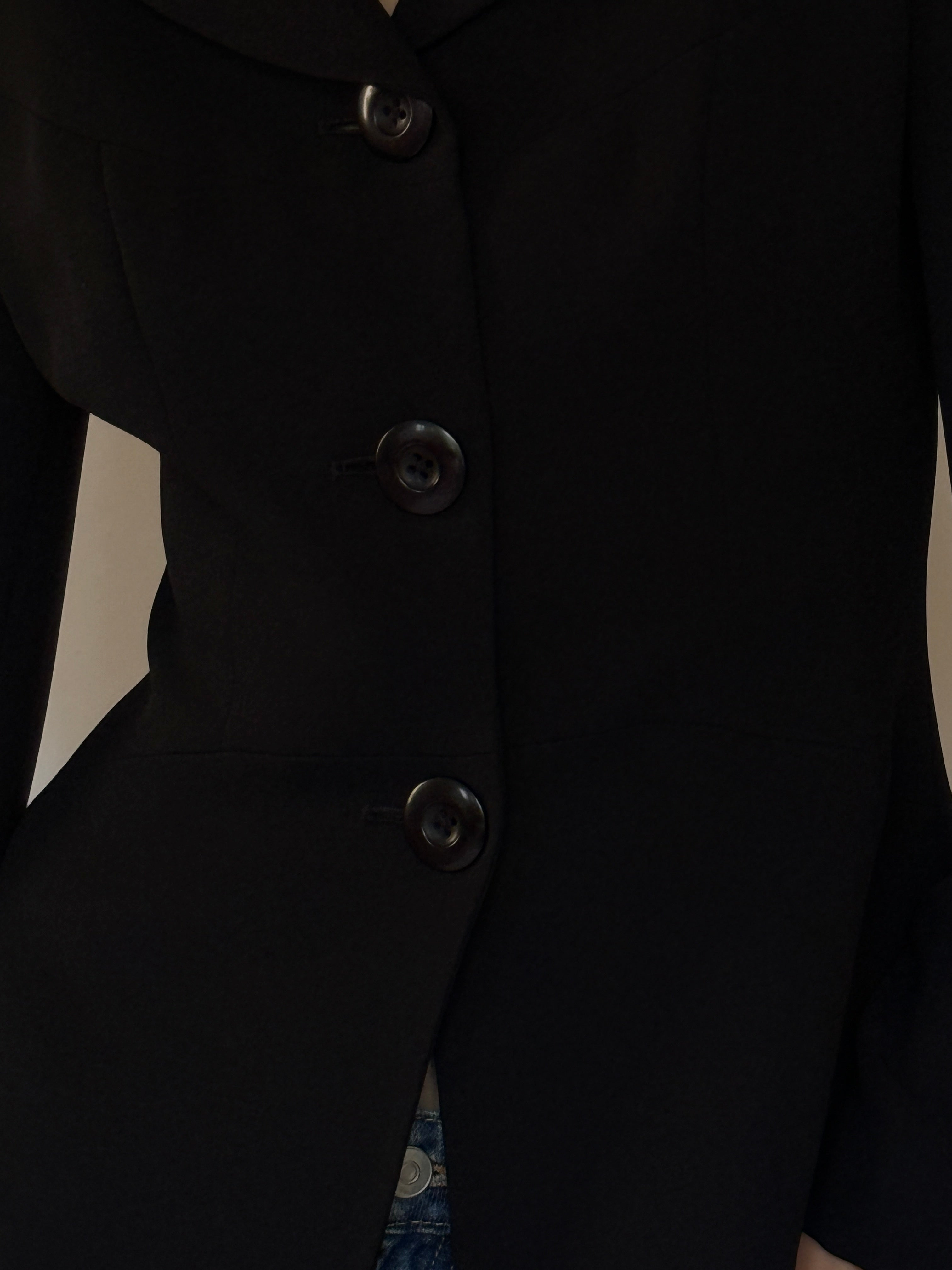 Vintage black blazer fabric close-up