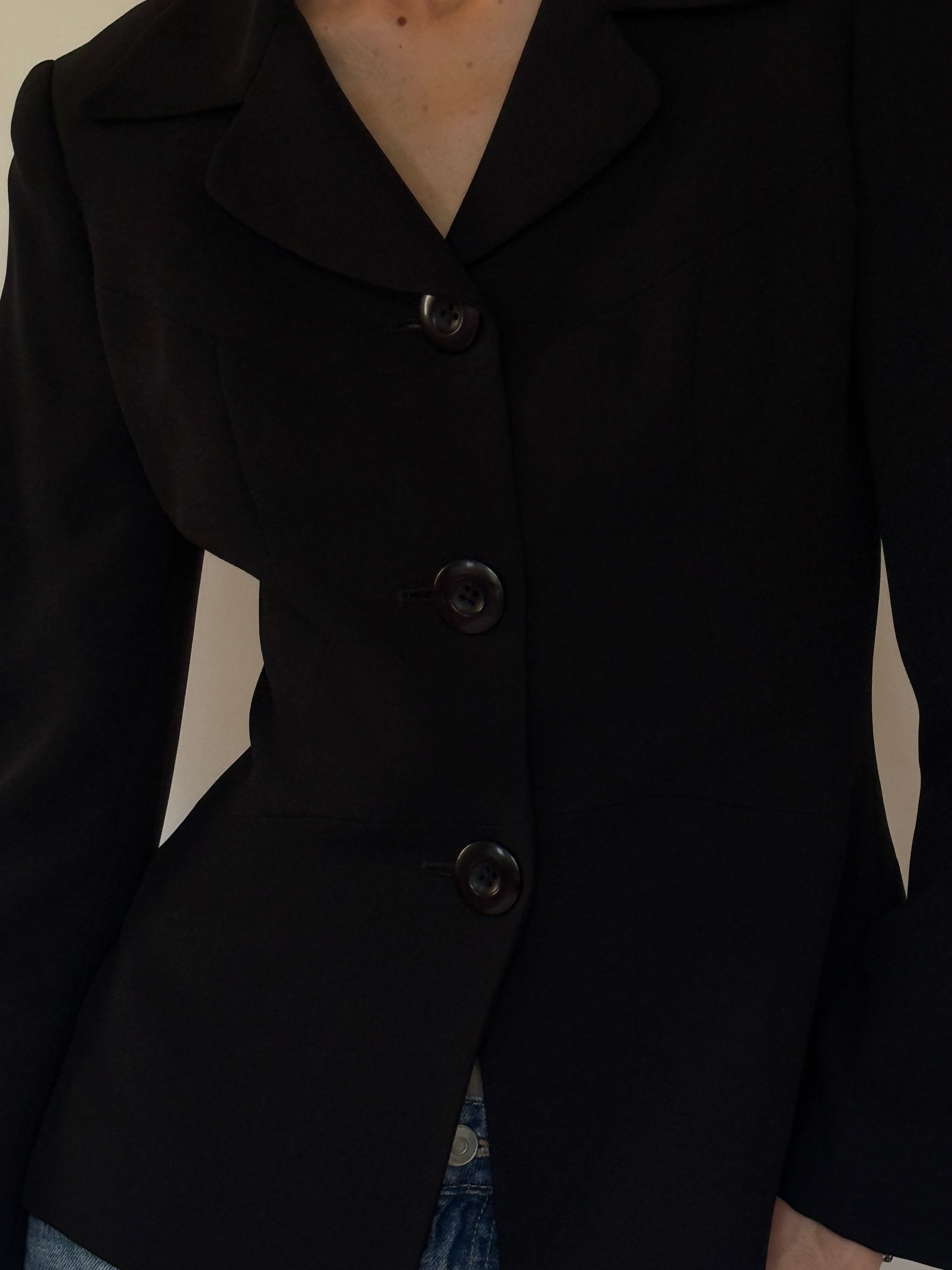 Vintage black blazer fabric close-up