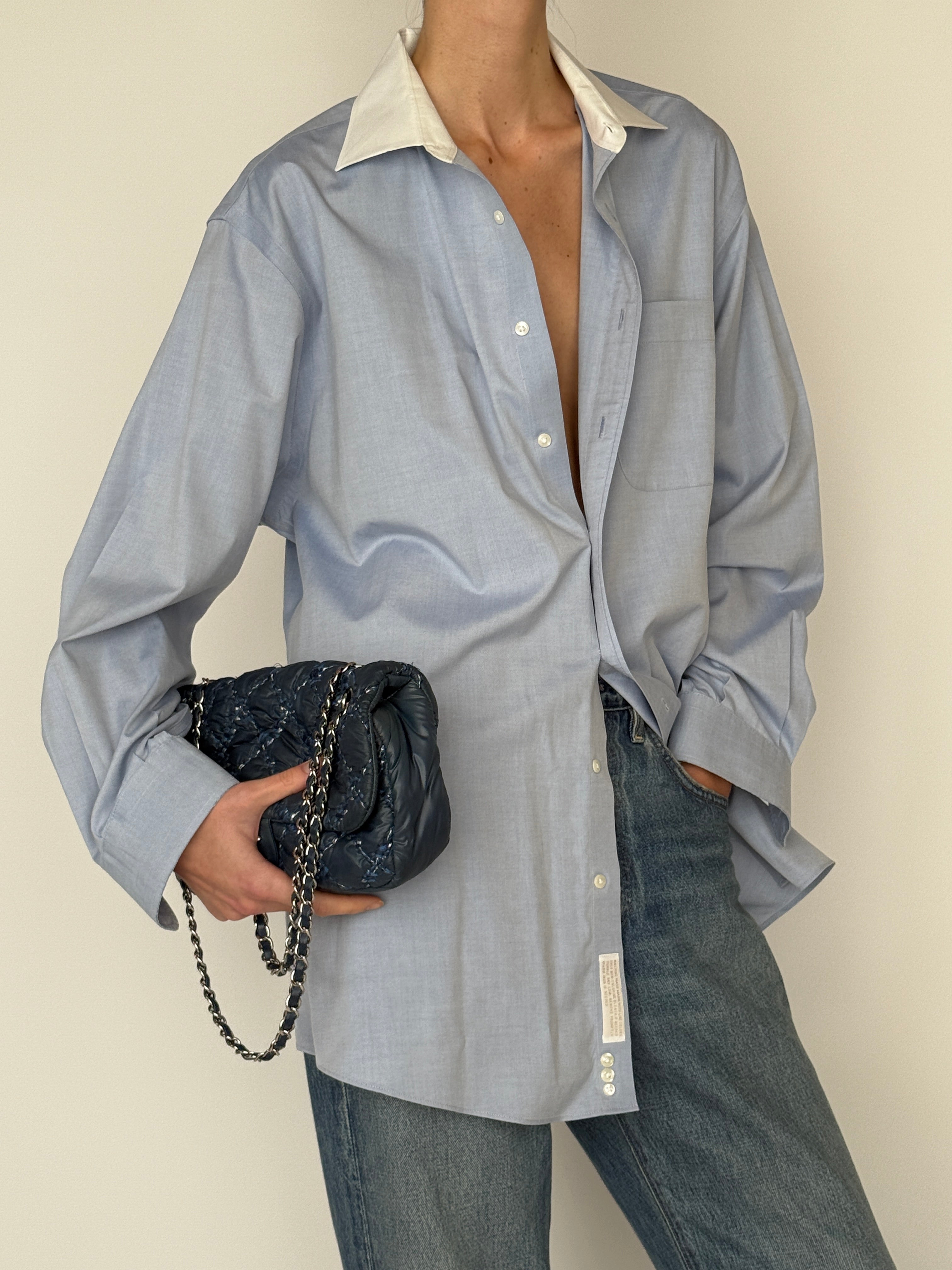 Vintage light blue button-down shirt with white collar close-up