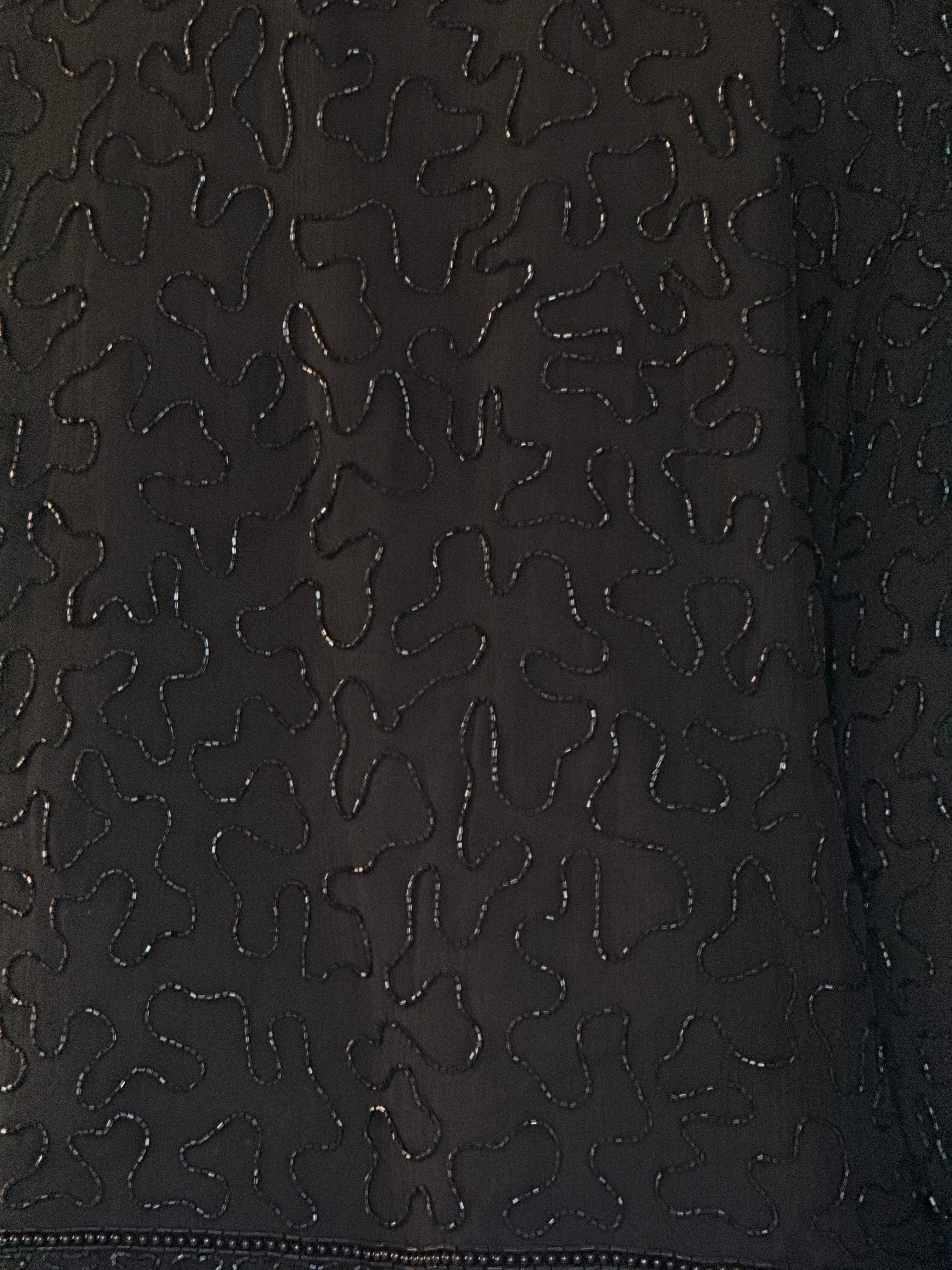 Vintage black tonal beadwork close-up
