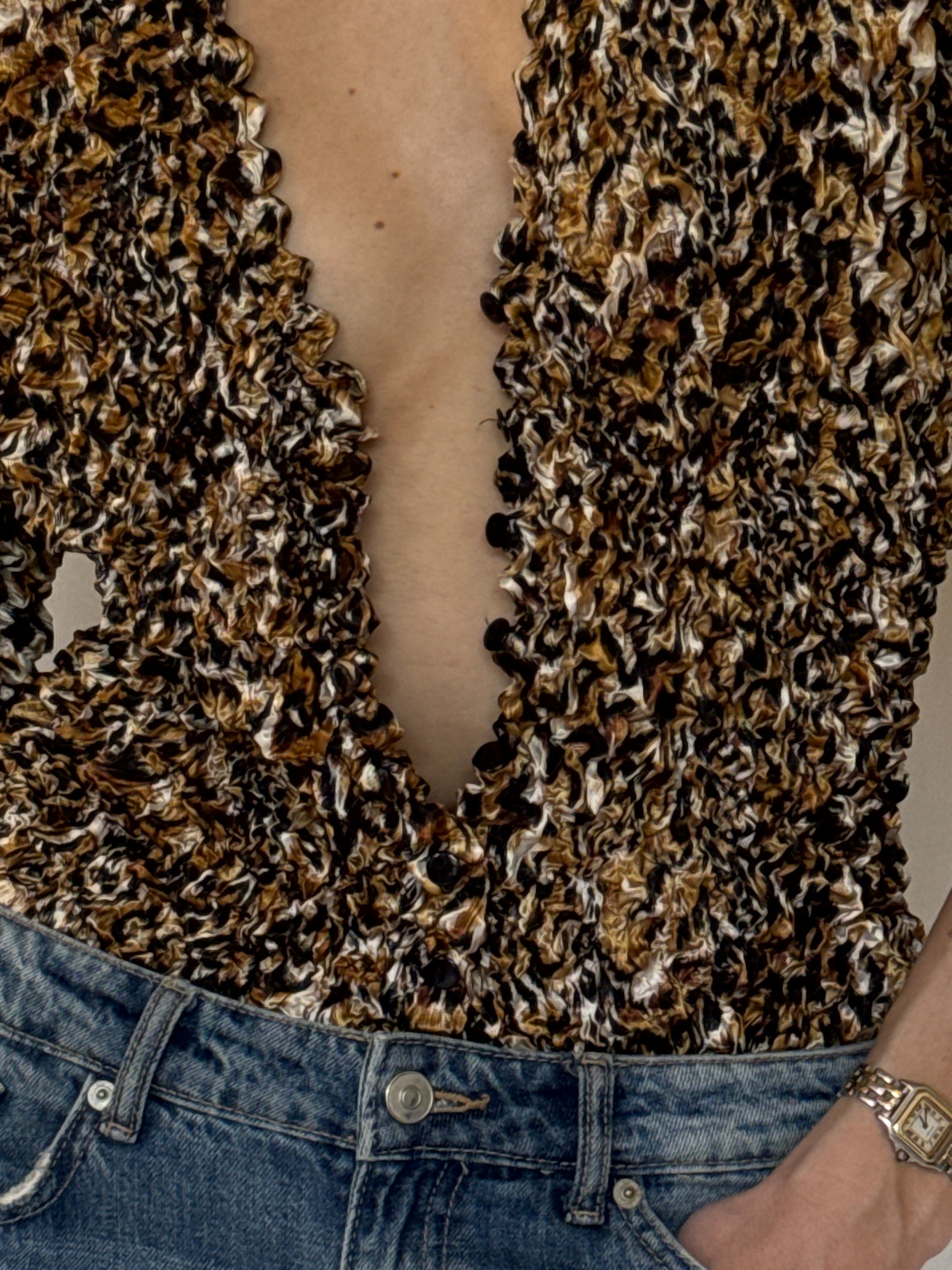Vintage popcorn fabric close-up with brown abstract pattern
