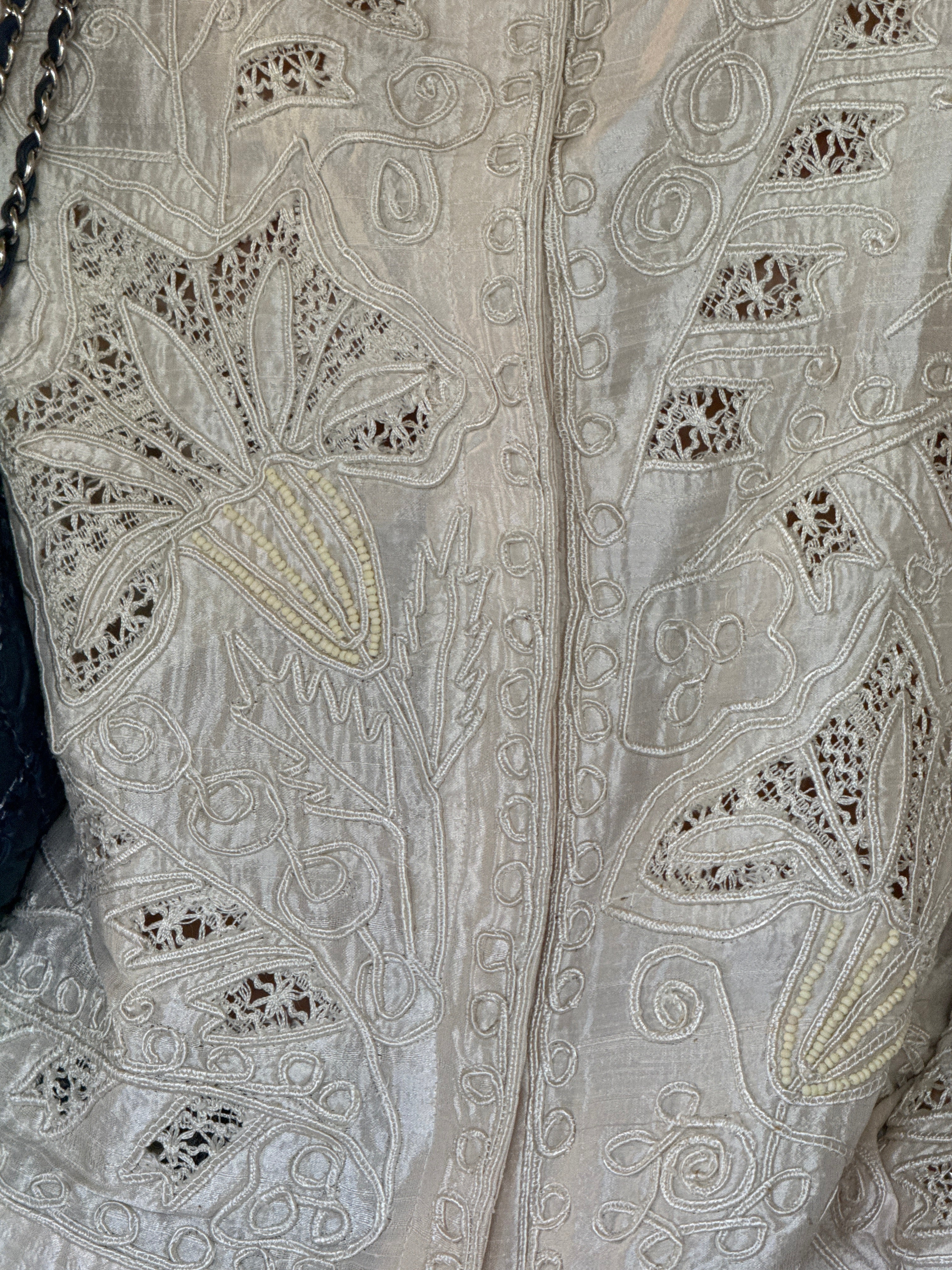 Vintage beaded floral motif detail on silk jacket