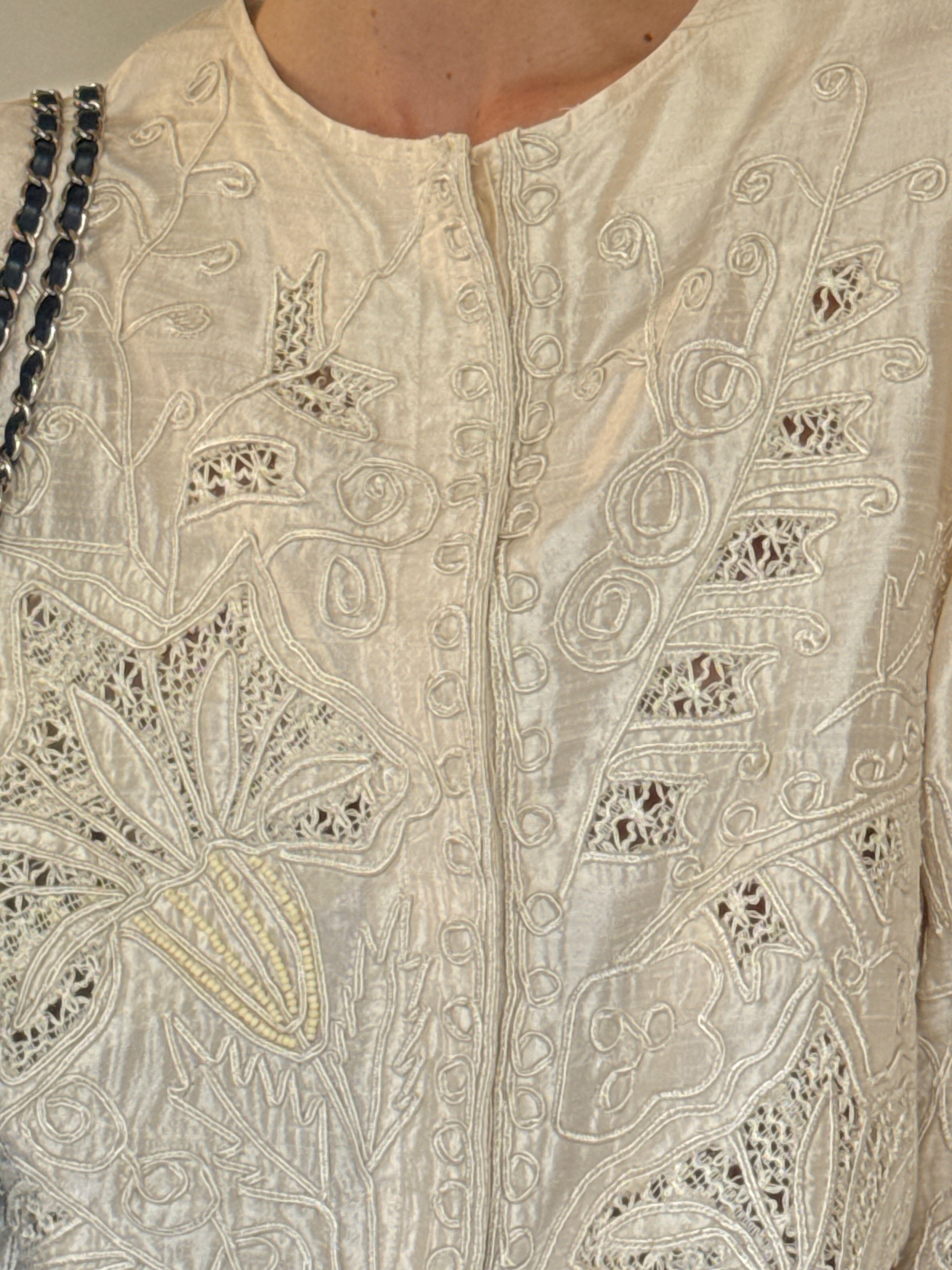 Vintage beaded floral motif detail on silk jacket