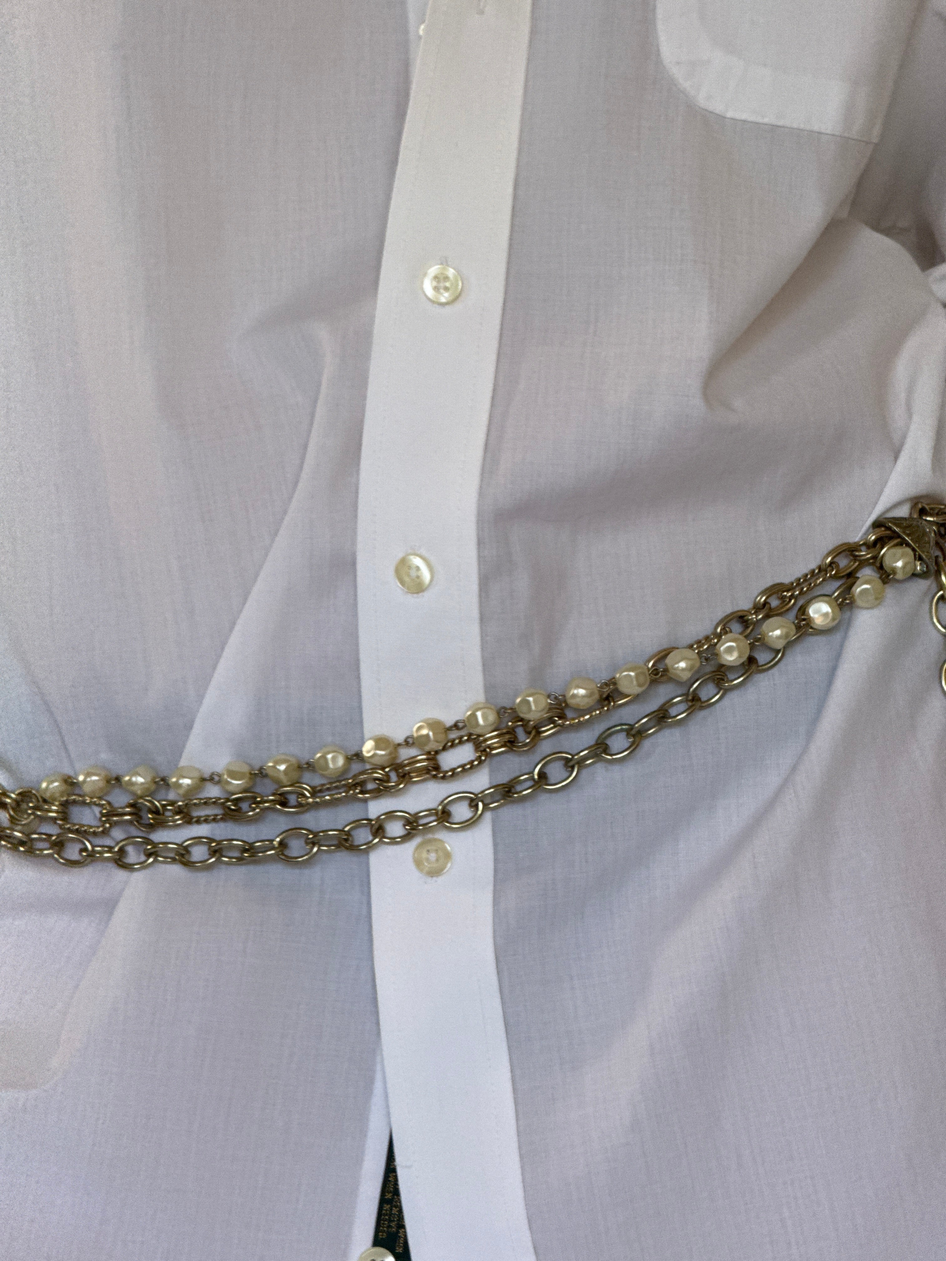 Vintage layered chain belt close-up