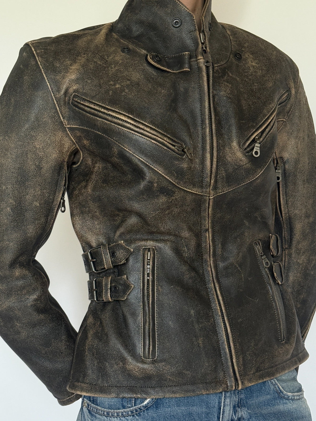 Vintage distressed leather moto jacket front zipper detail