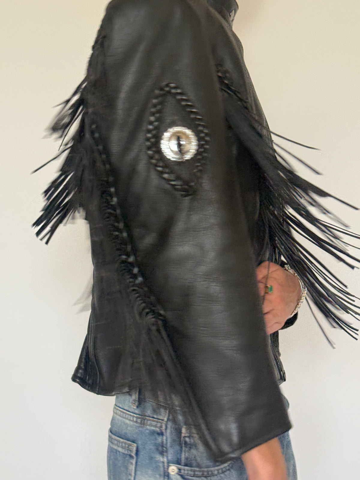 Vintage structured Western fringe motorcycle leather jacket side view