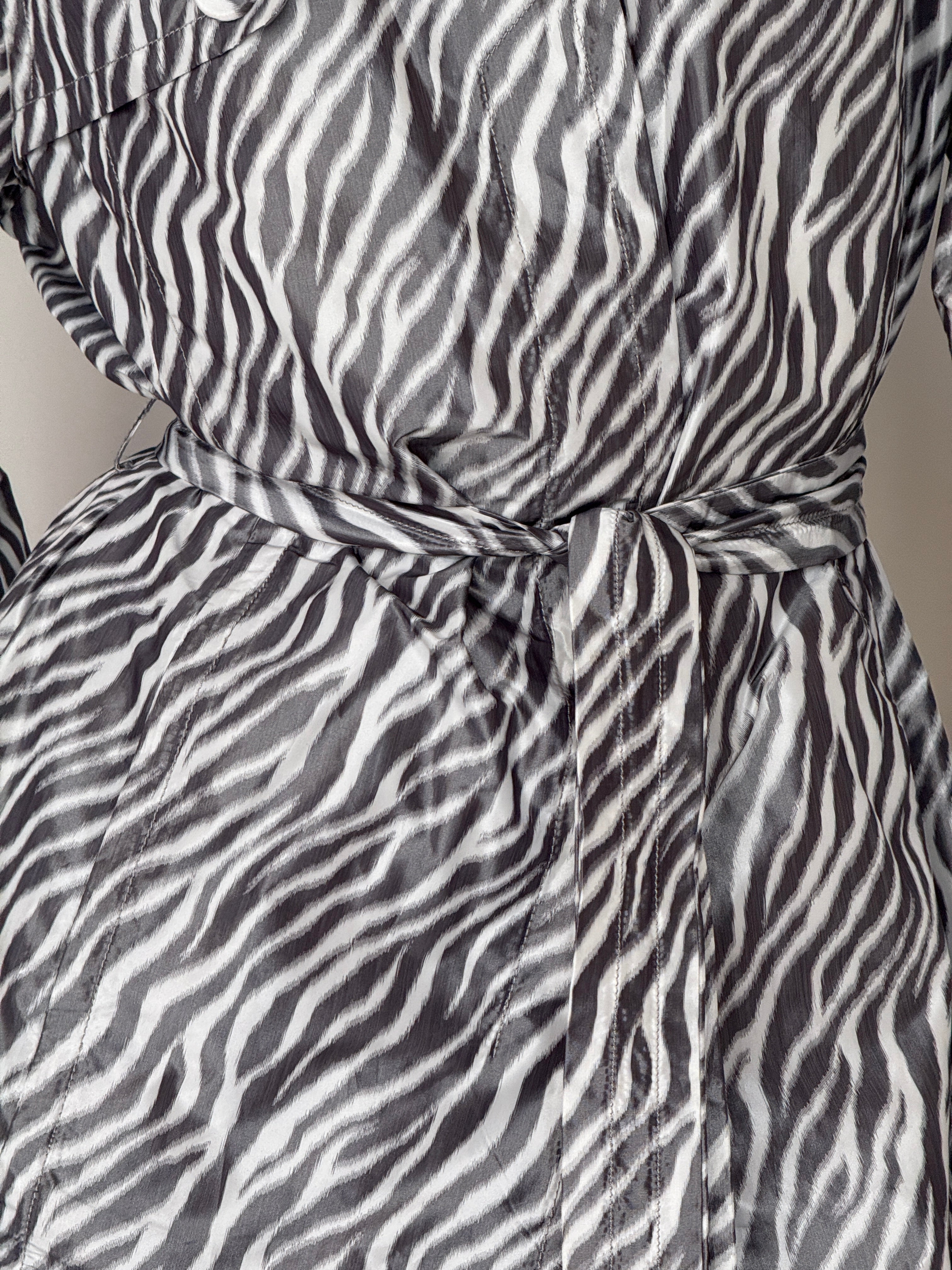Vintage zebra print trench coat button detail
