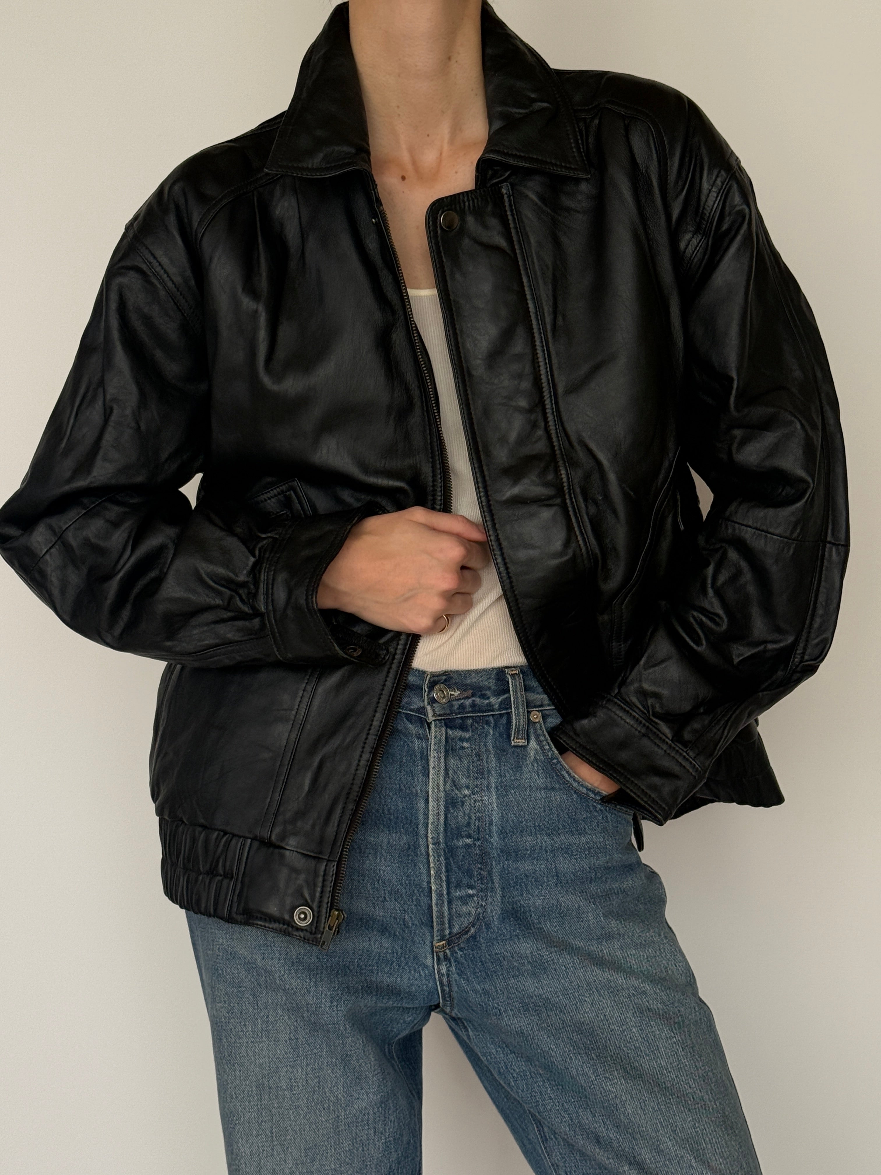 Vintage black leather bomber jacket front view