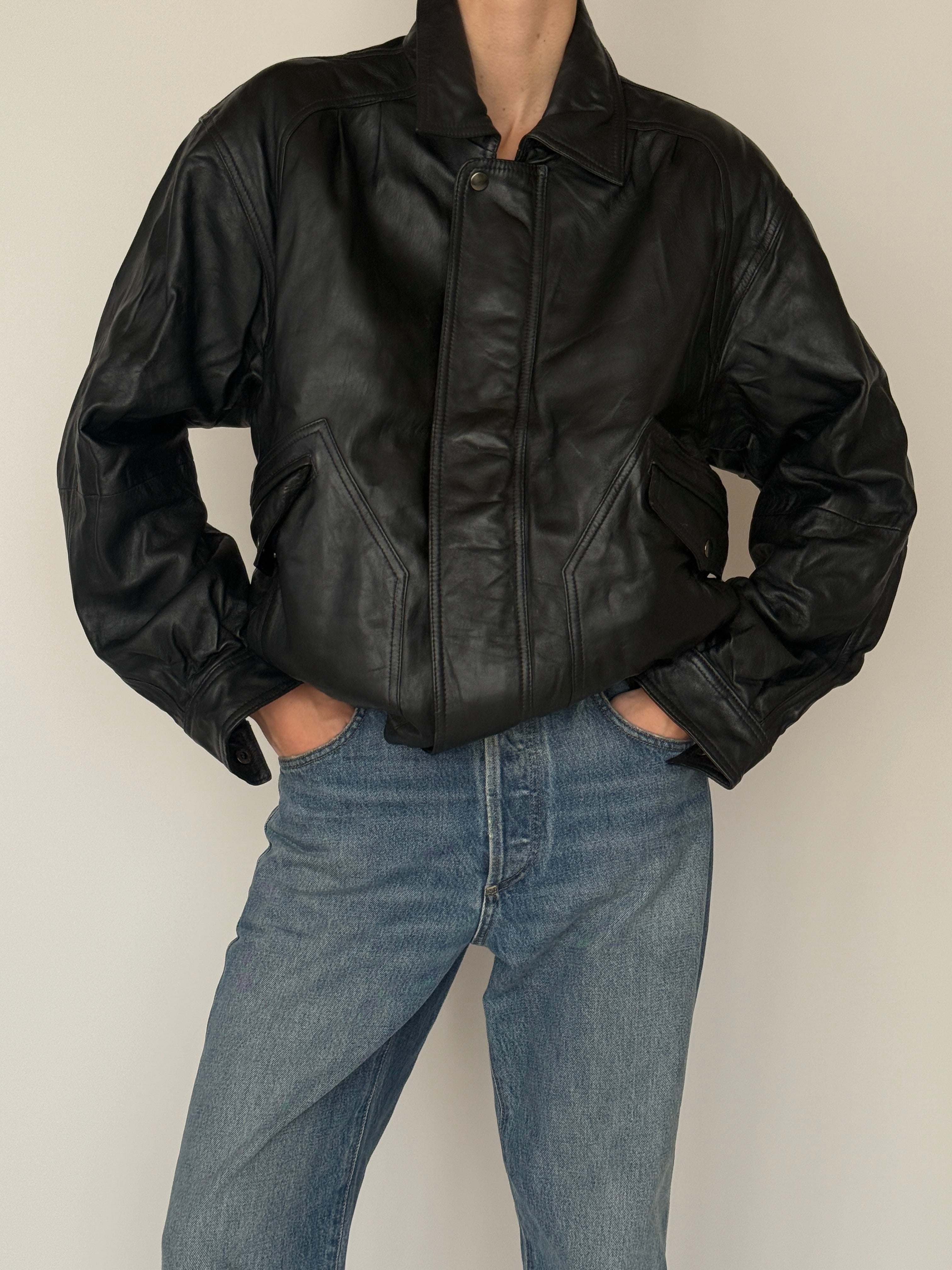 Vintage black leather bomber jacket front view