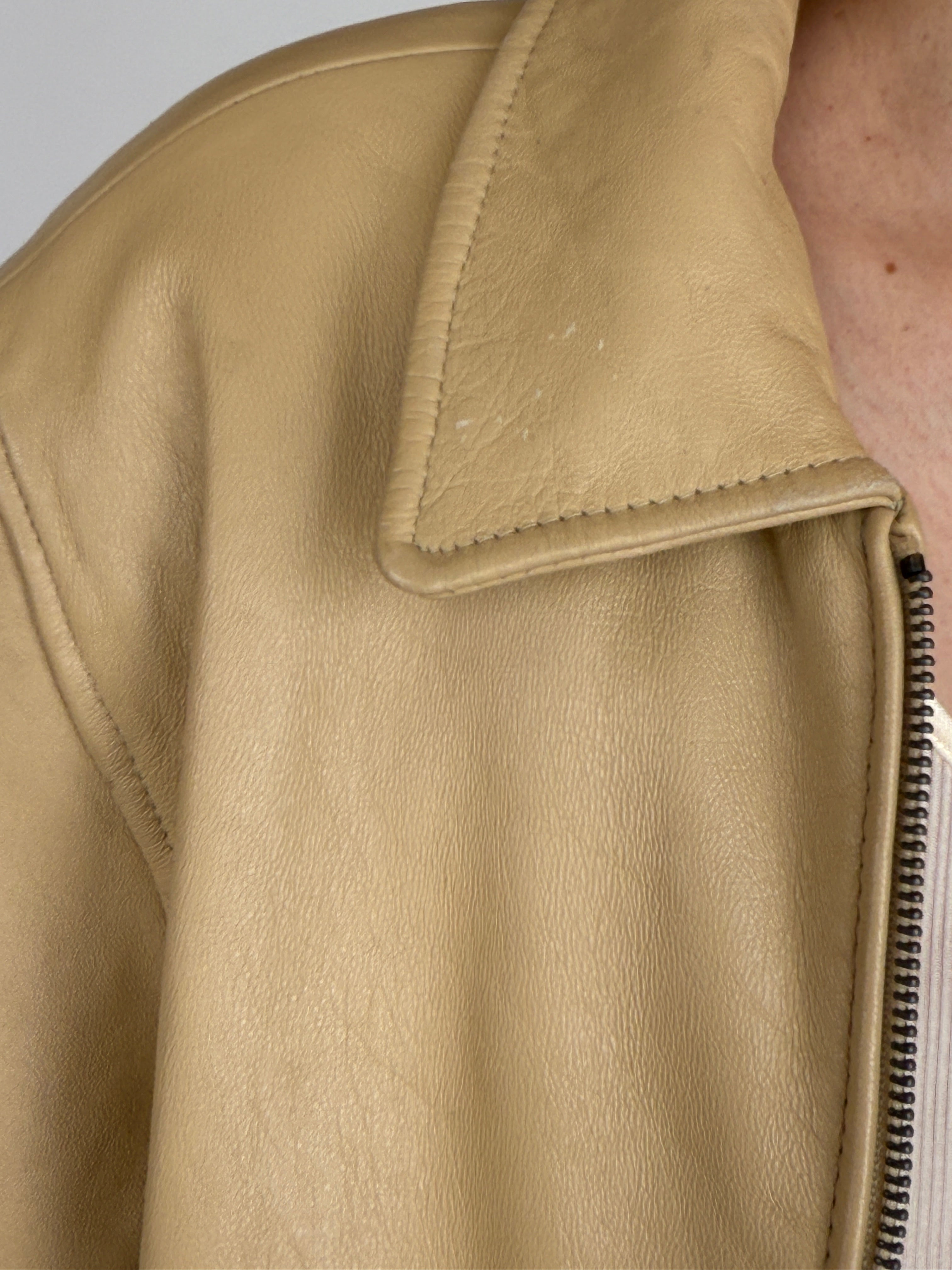Vintage beige leather jacket collar detail