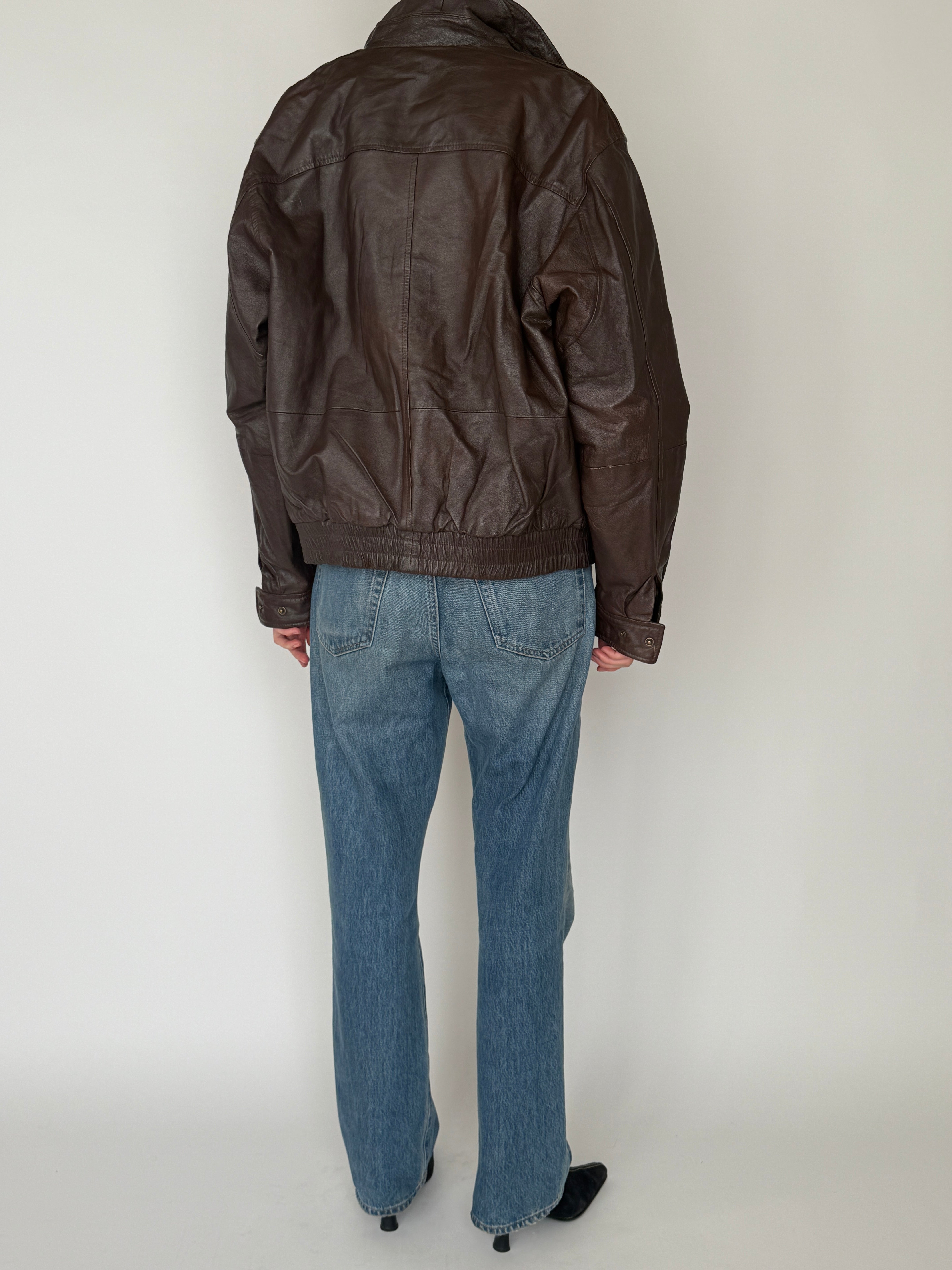 Vintage dark brown leather jacket back view