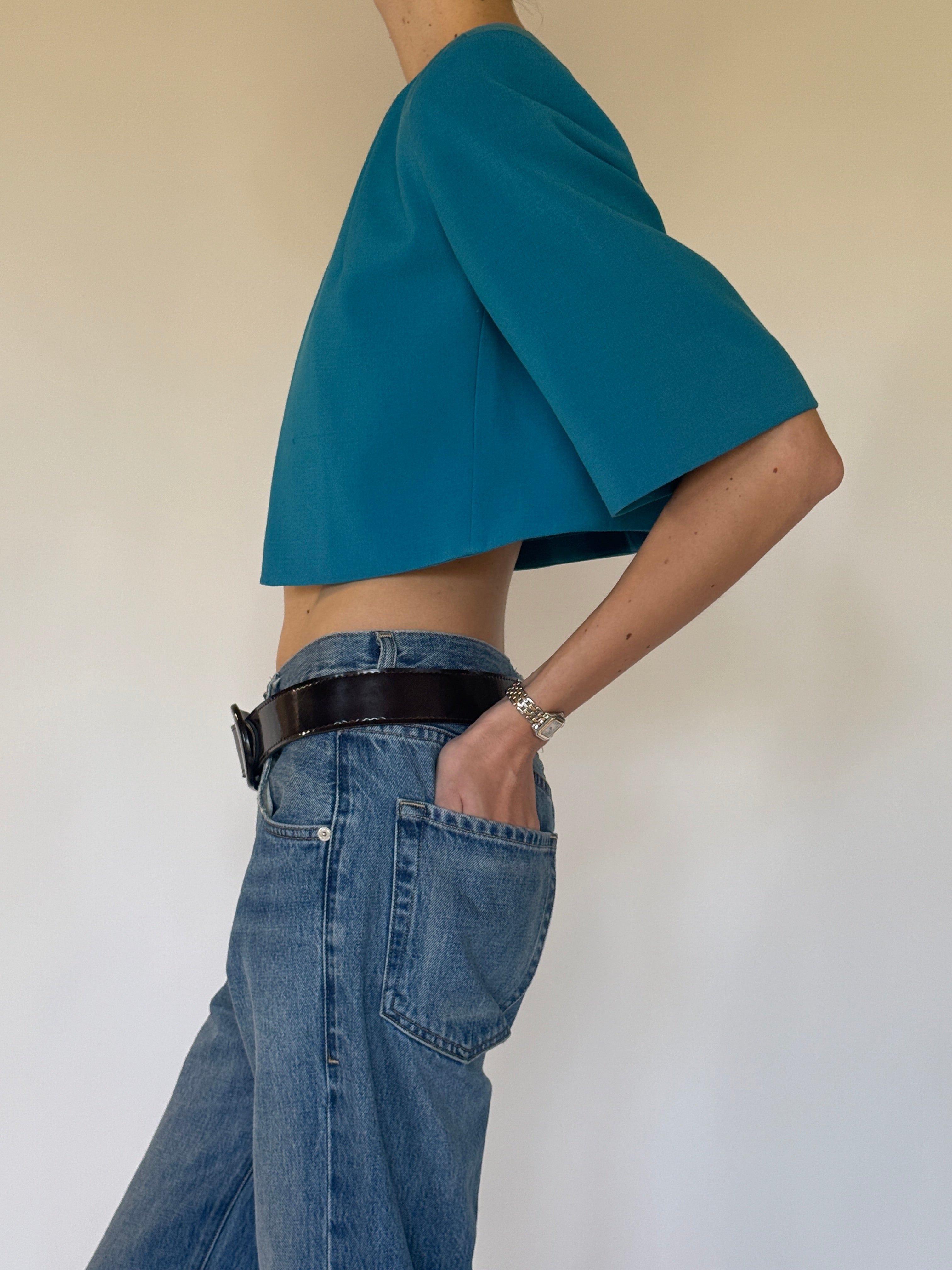 Vintage Calvin Klein teal cropped stretch jacket side view sculptural sleeve