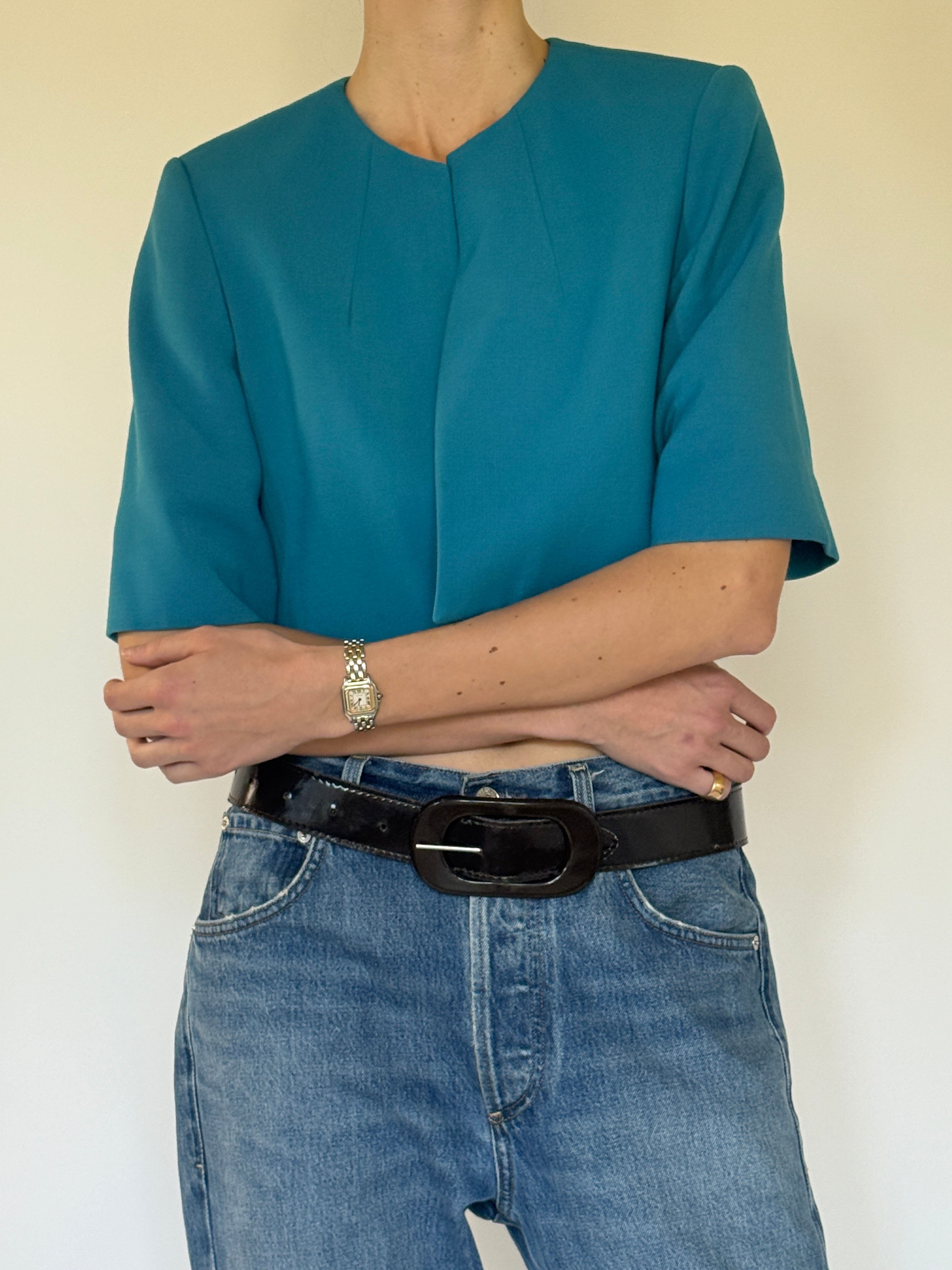 Vintage Calvin Klein teal cropped stretch jacket fabric texture close-up
