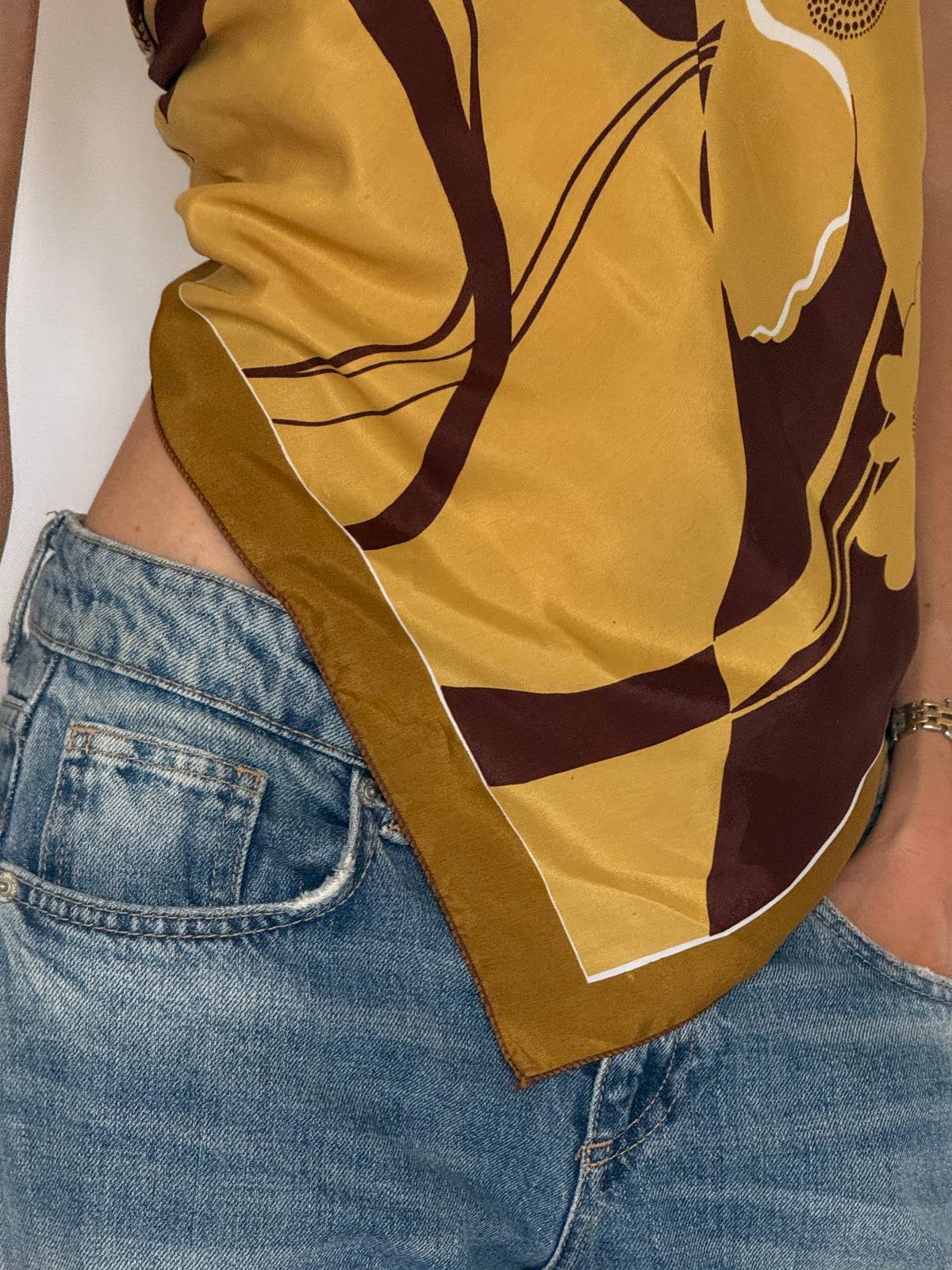 Vintage mustard and brown floral scarf print close-up