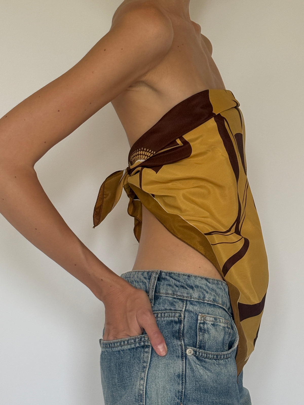 Vintage mustard floral scarf styled as a top side view