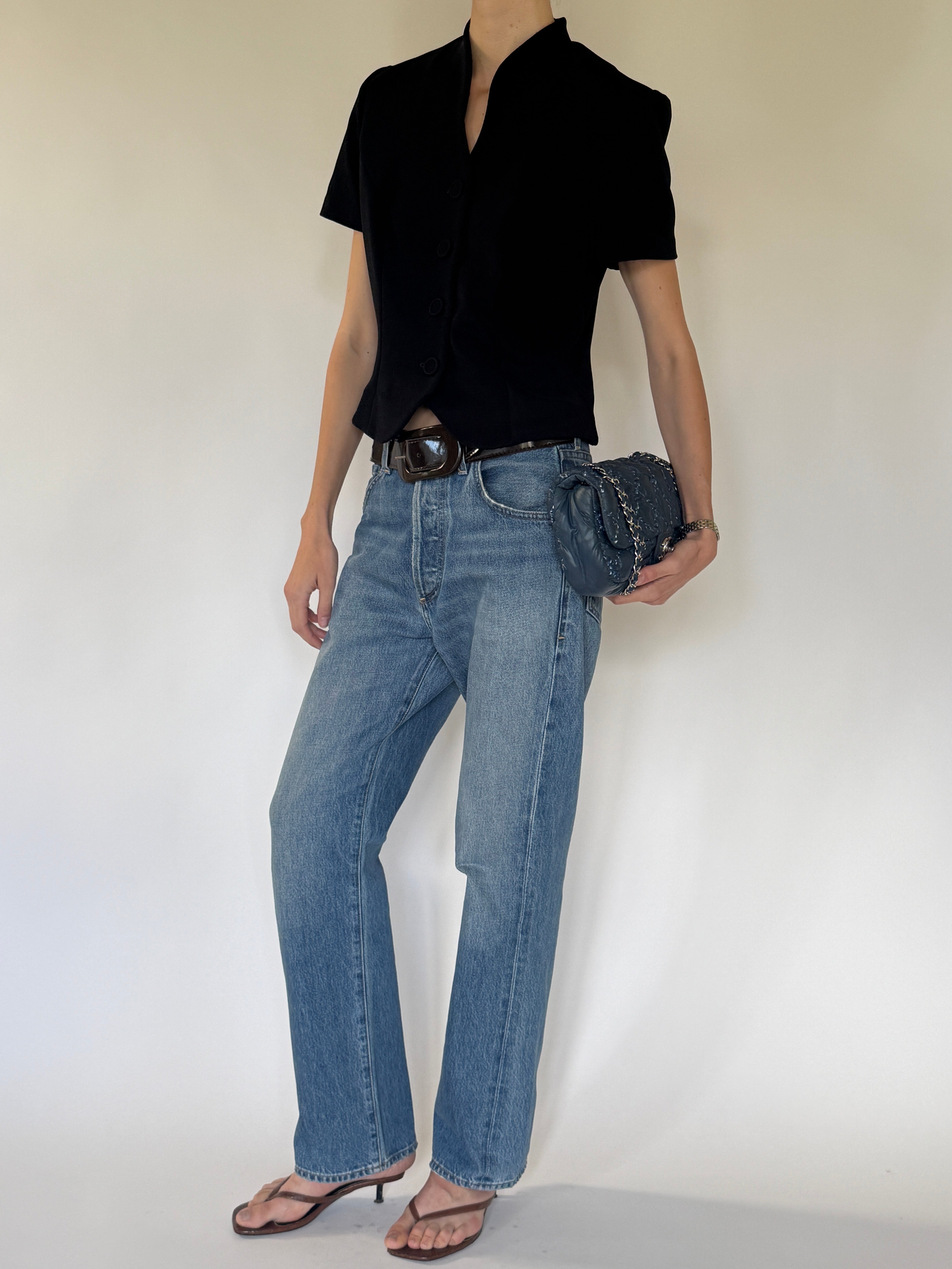 Vintage black button-front top side view