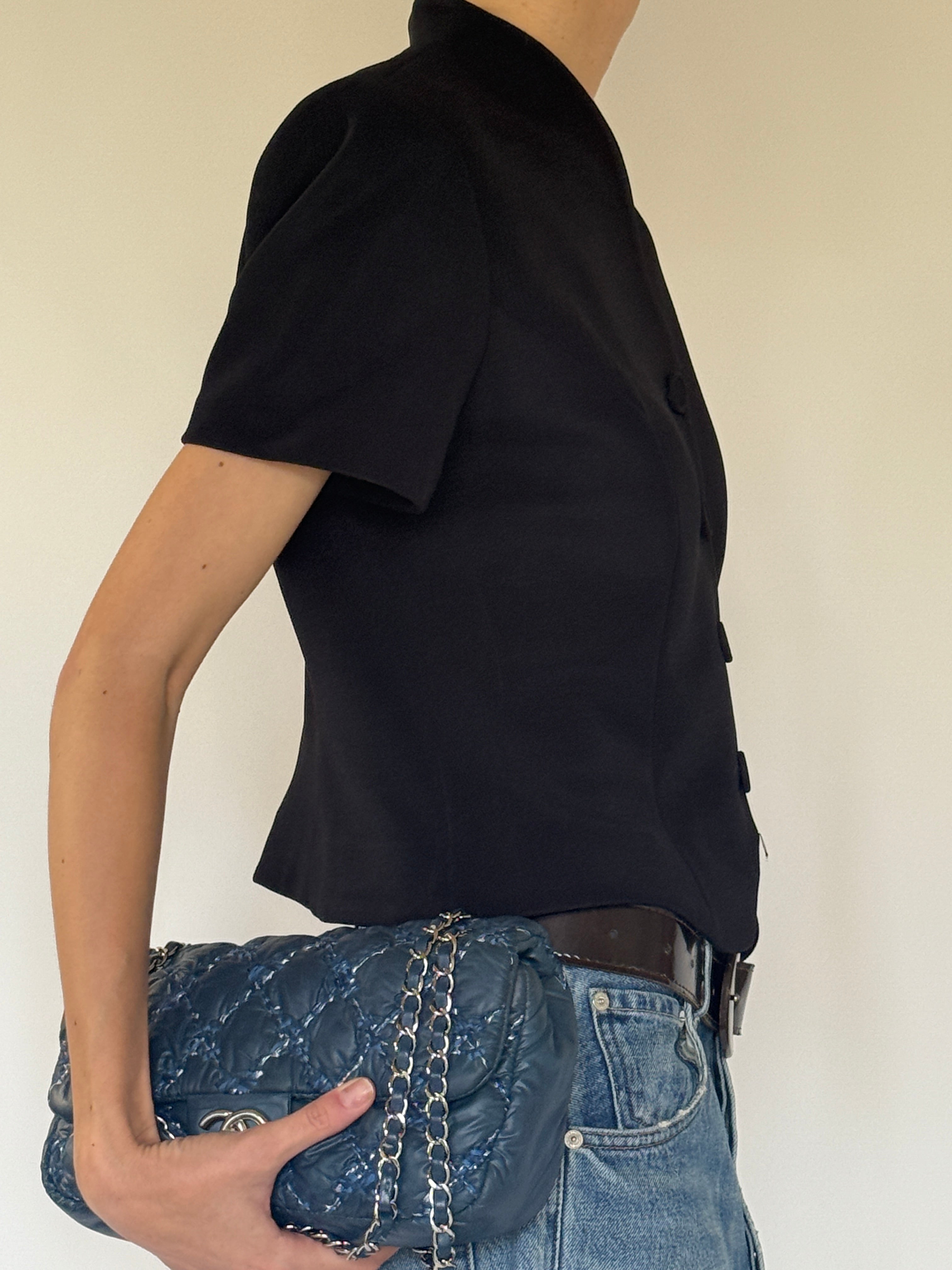 Vintage black button-front top side view