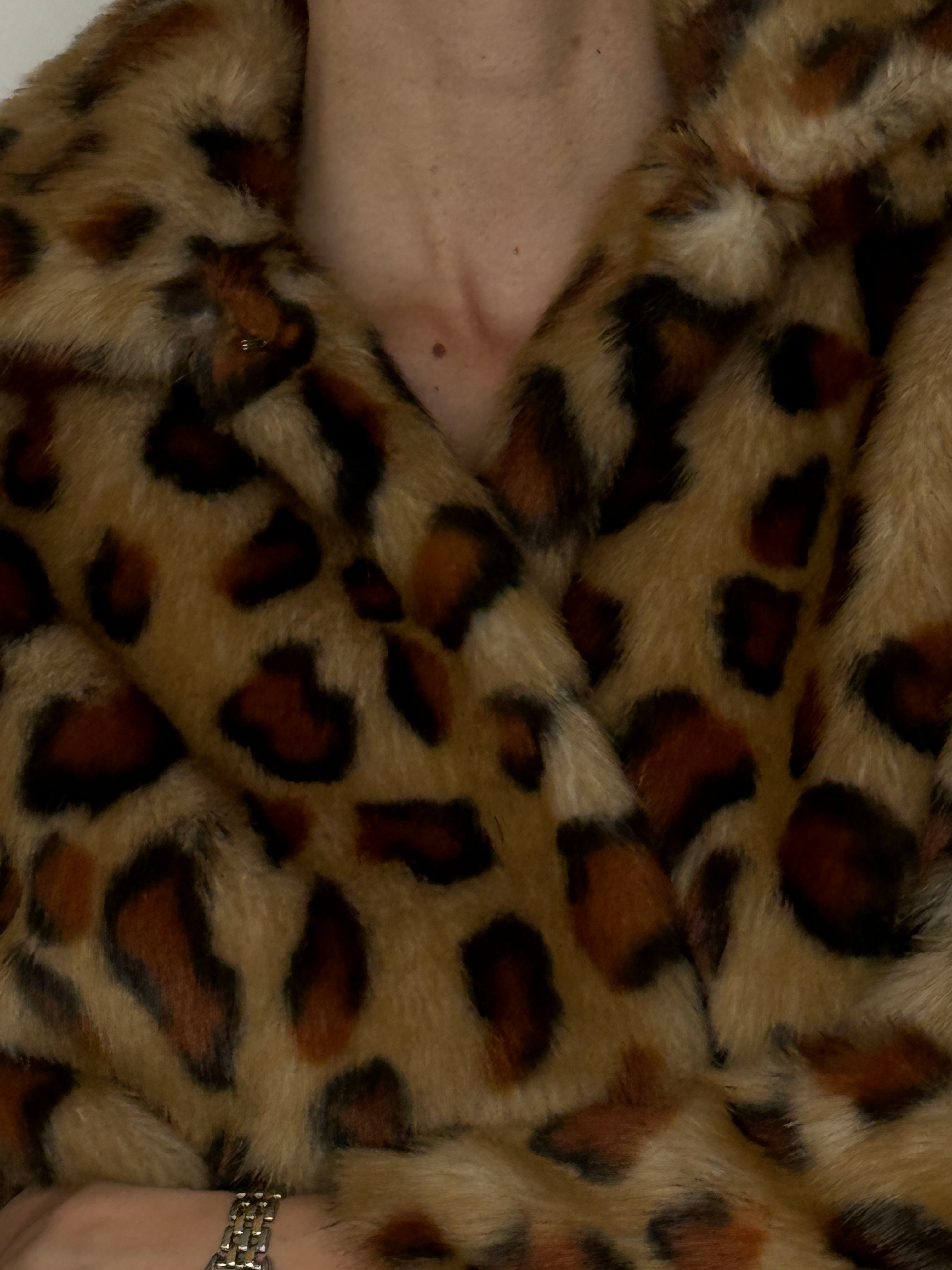Vintage leopard faux fur jacket texture close up