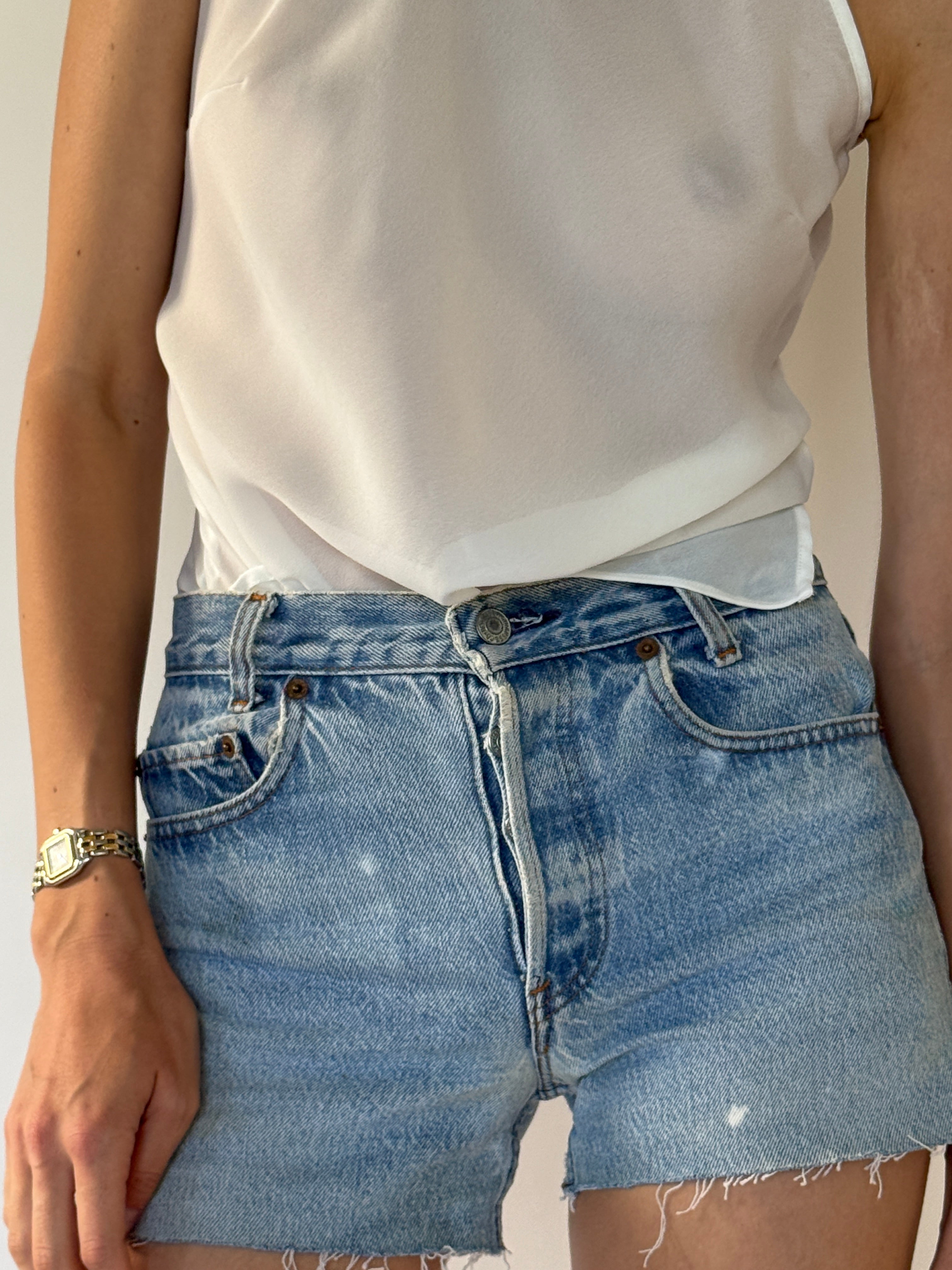 Vintage Levi's light blue denim shorts front view