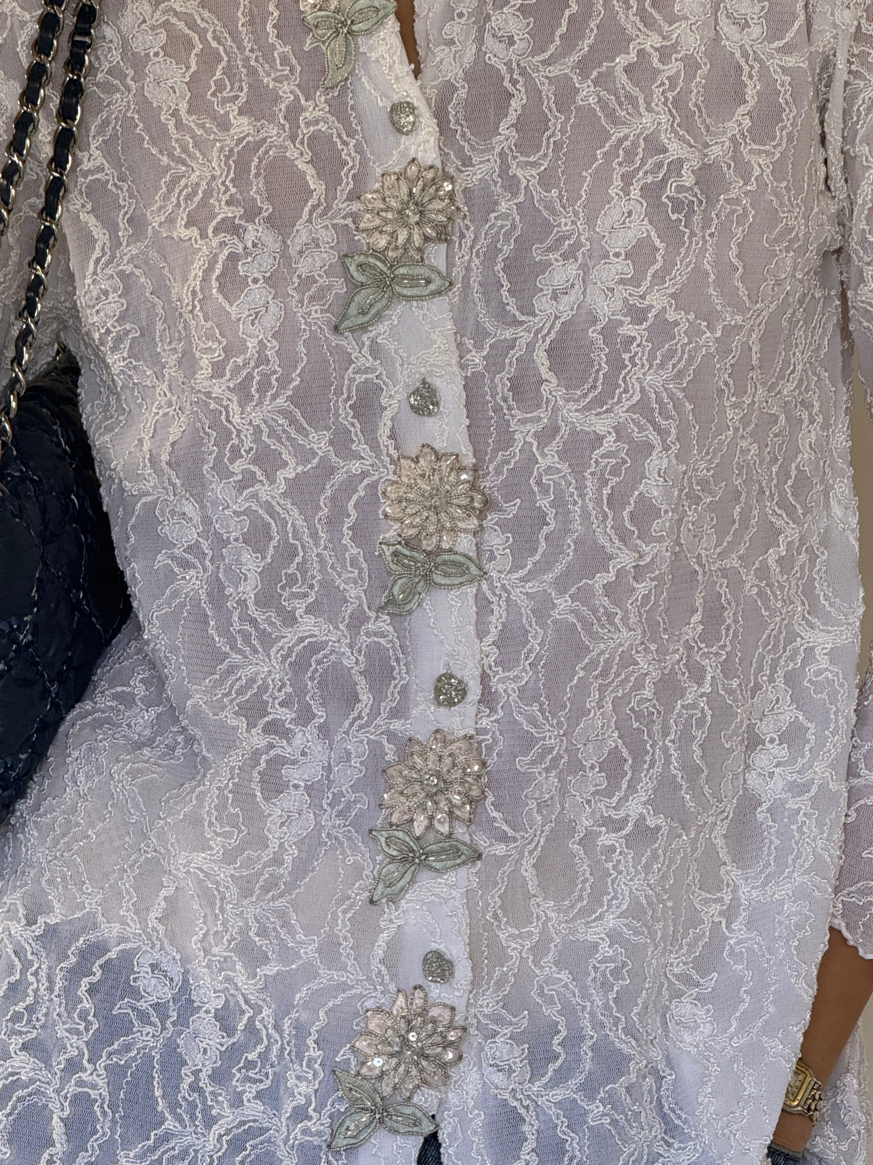 Vintage lace blouse button and appliqué detail