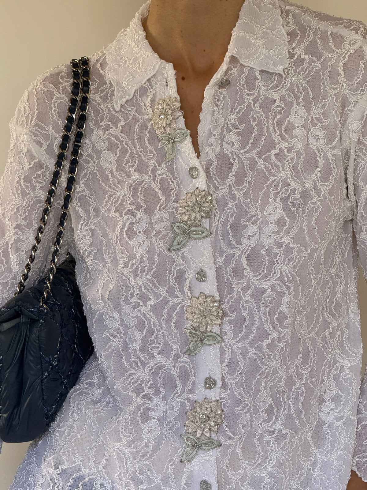 Vintage lace blouse front detail with floral buttons