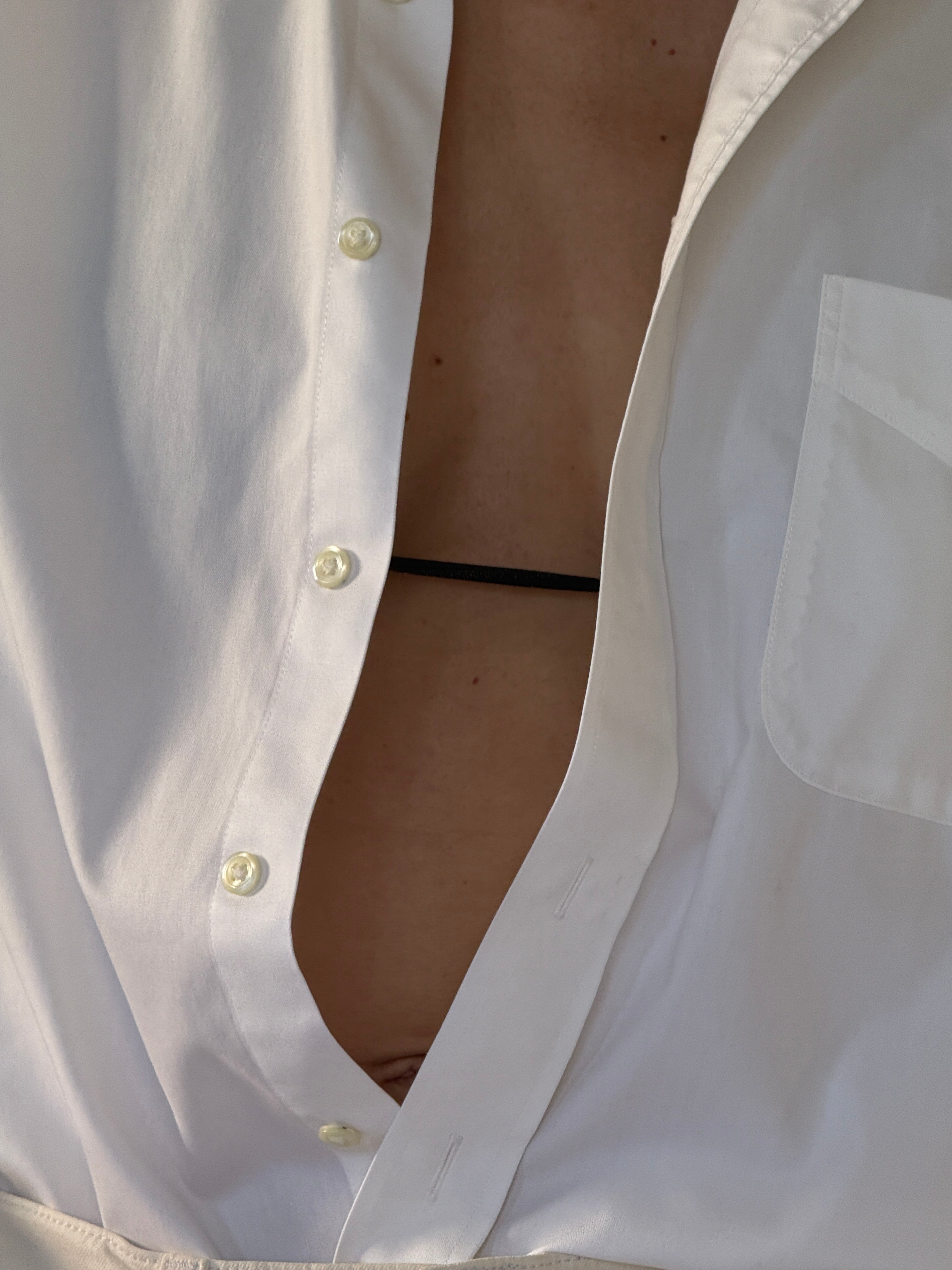 Vintage white cotton shirt fabric close-up