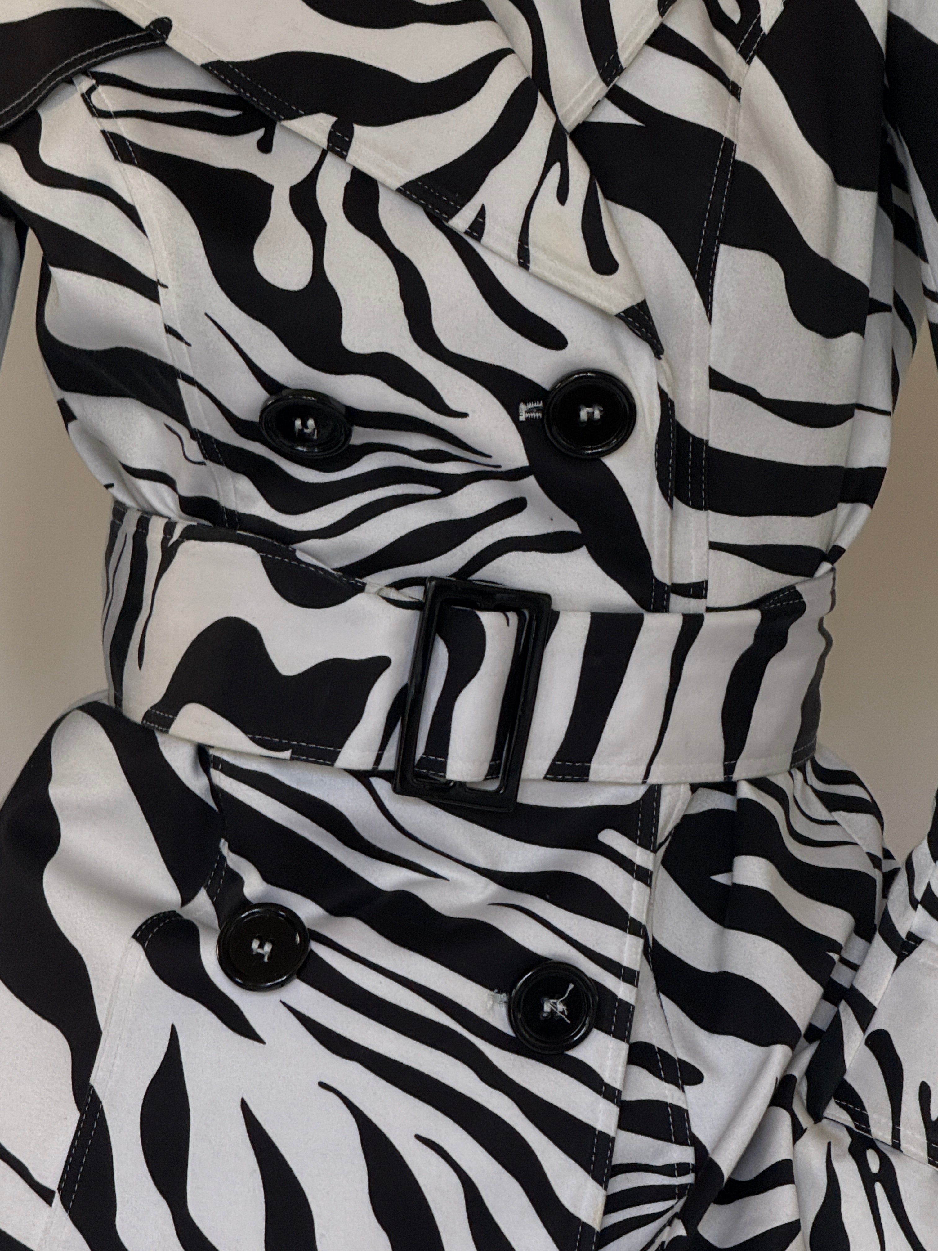 Vintage zebra print belted trench jacket fabric close-up