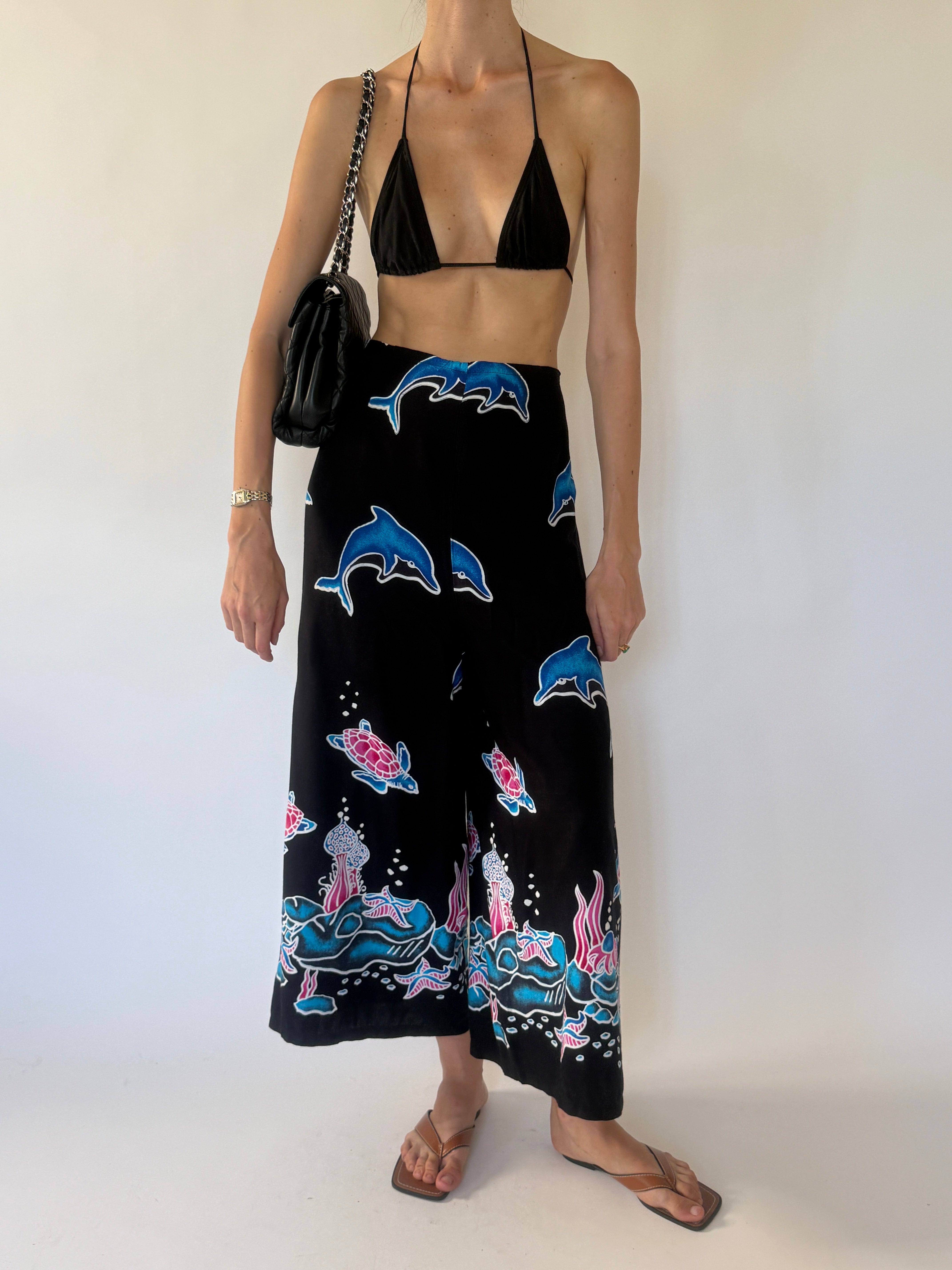 Vintage black ocean print wrap pants front view