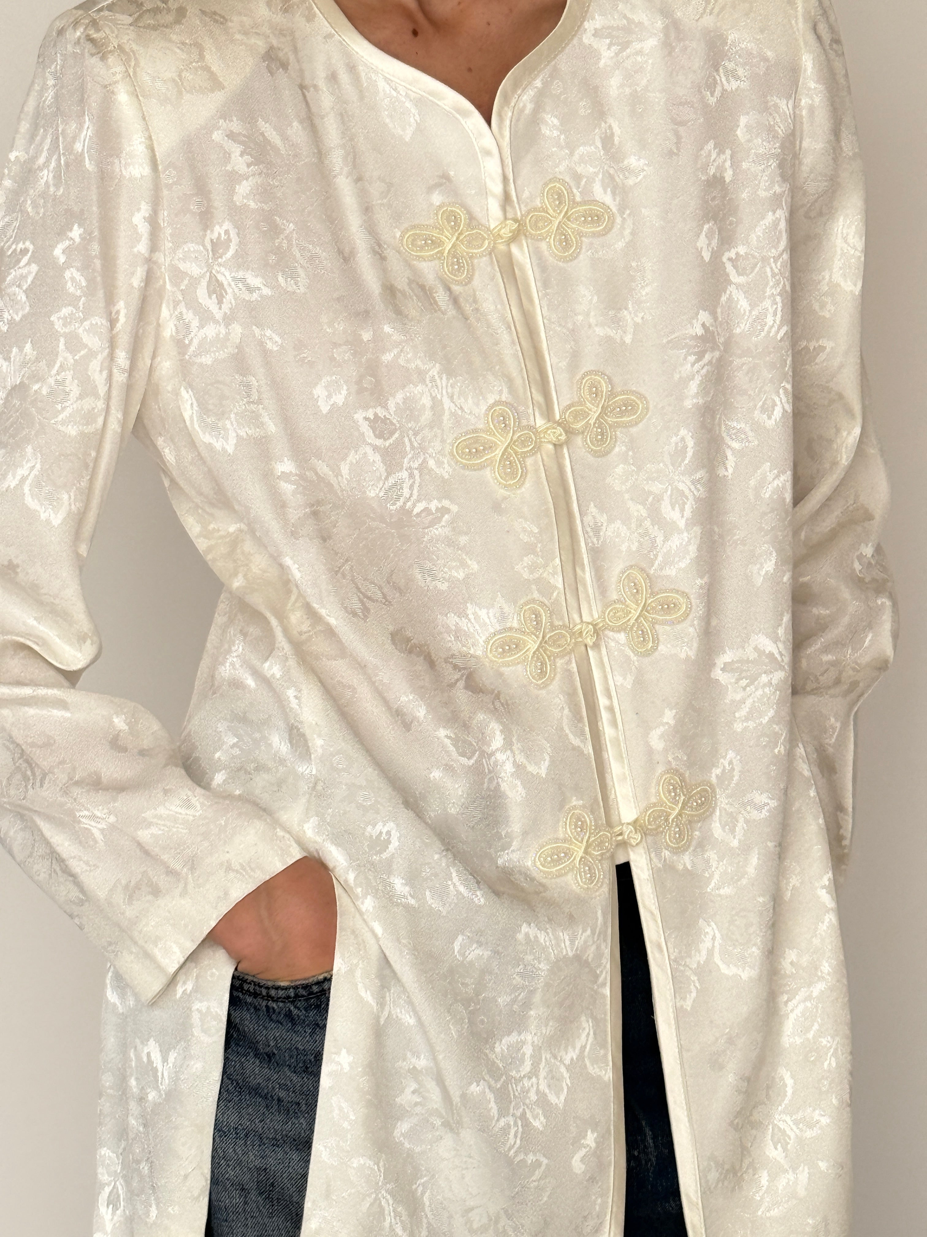 Vintage ivory jacquard frog closure jacket fabric close-up