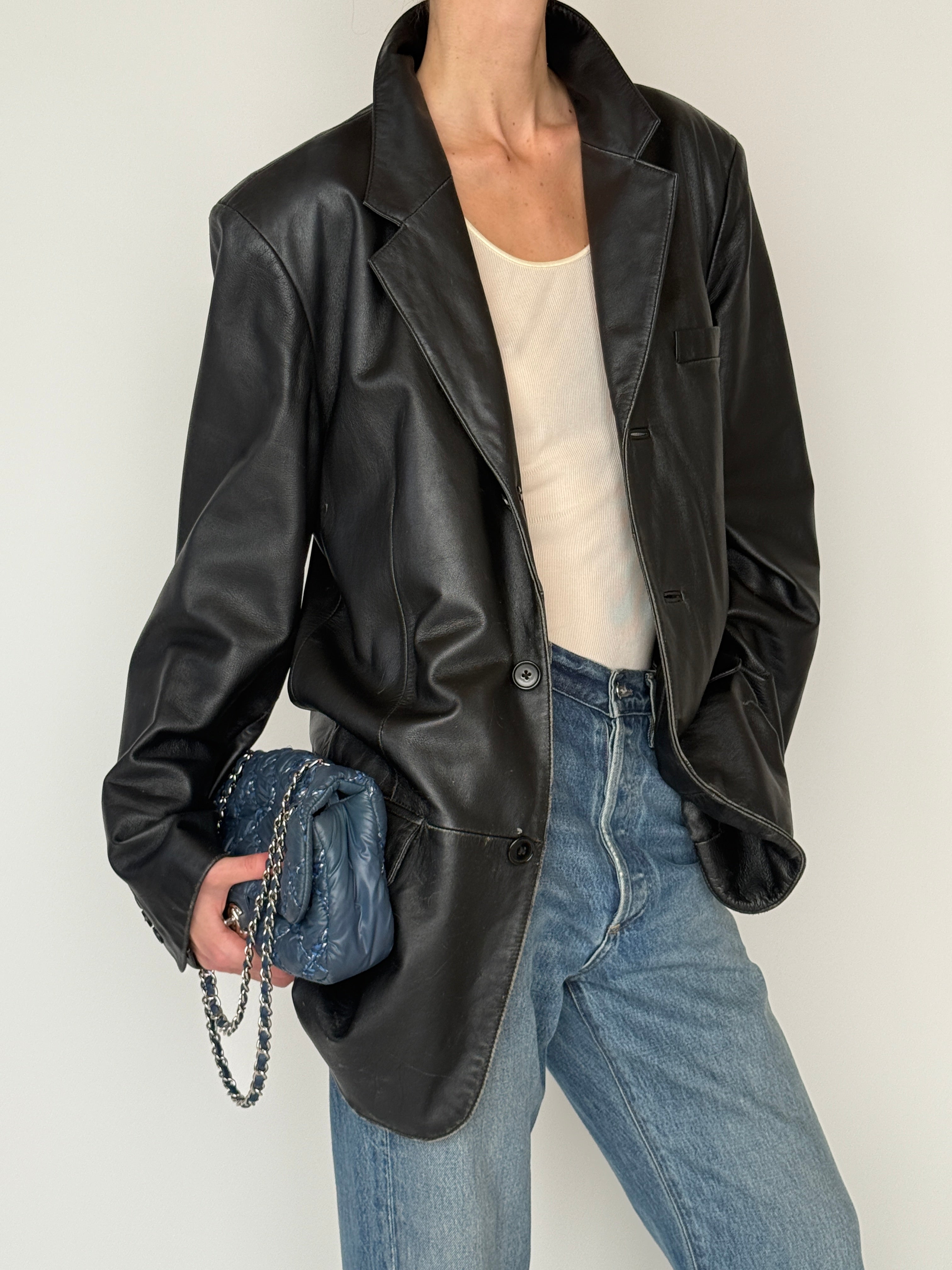 Vintage black leather blazer leather texture close-up