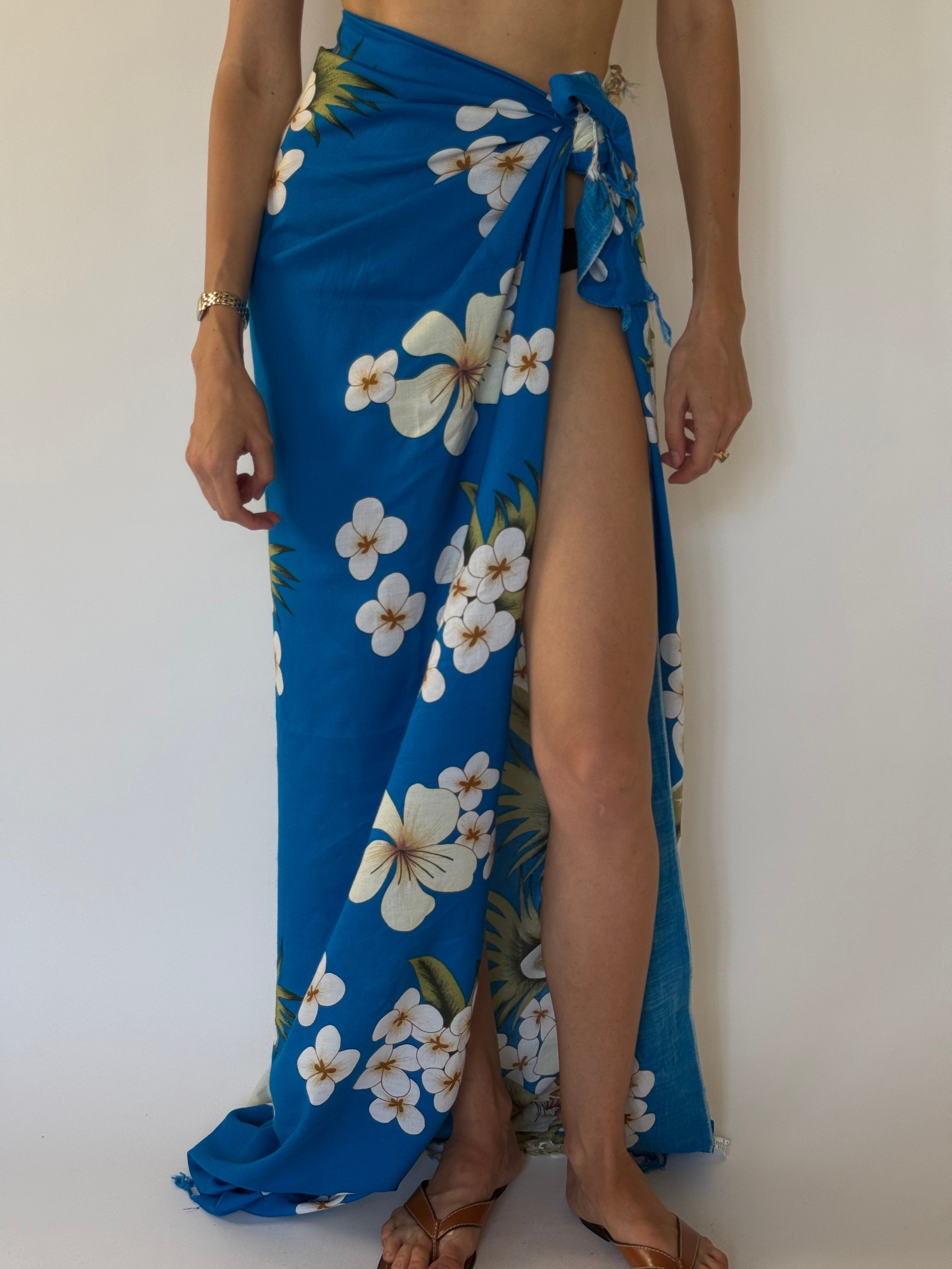 Vintage tropical blue floral beach pareo tied as a sarong