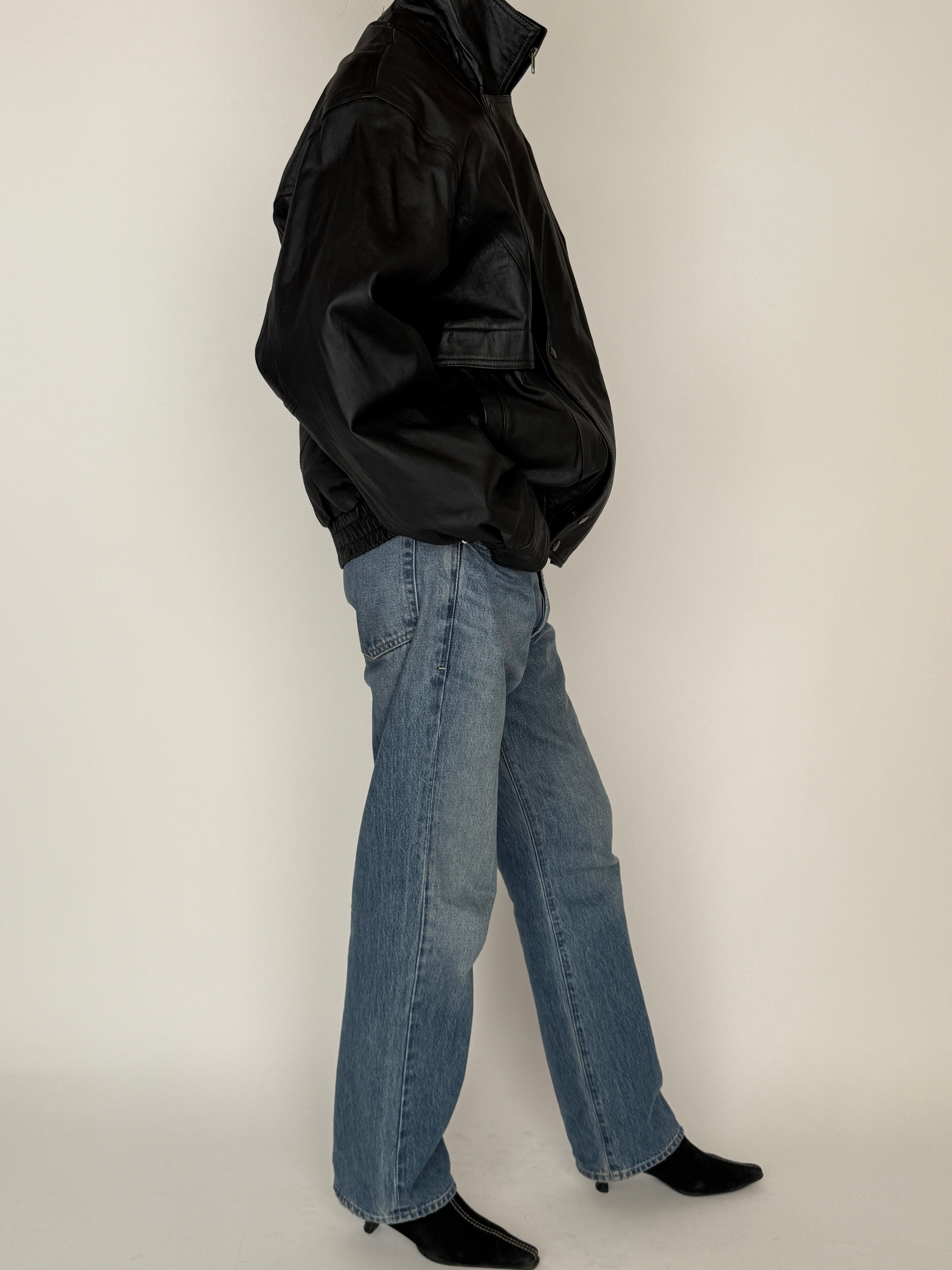 Vintage black leather jacket side view